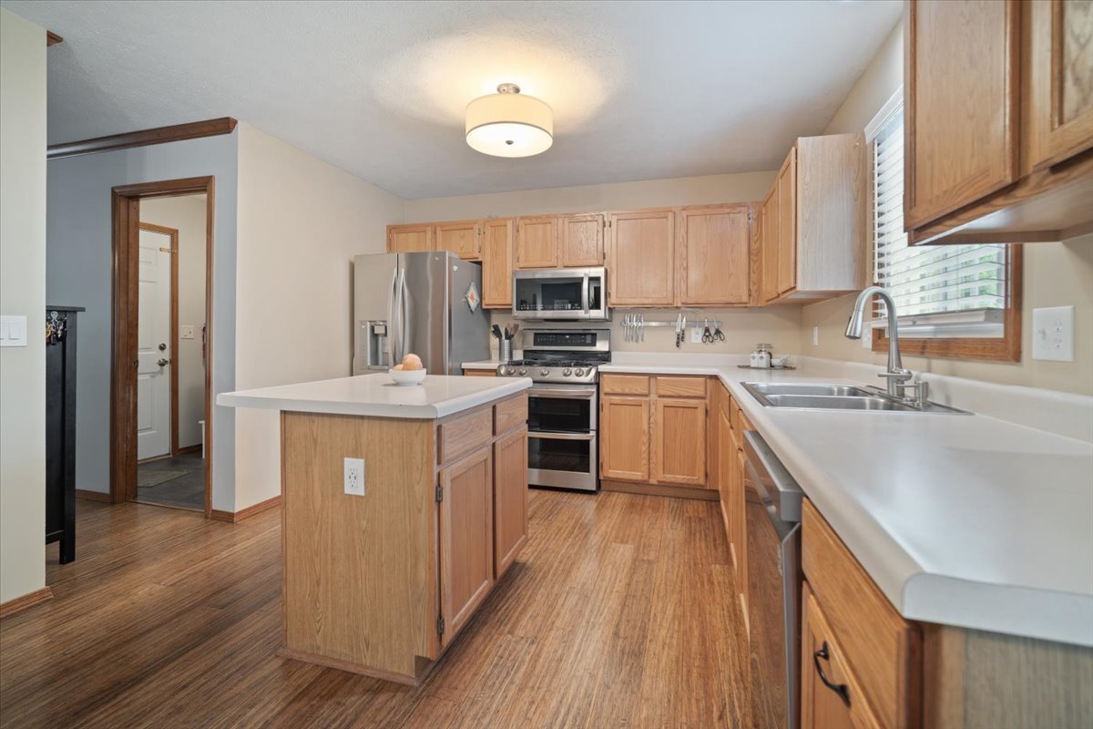1024 Kings Mill Road Normal, IL 61761 - Photo 5 of 21 a kitchen with kitchen island granite countertop wooden floors and stainless steel appliances