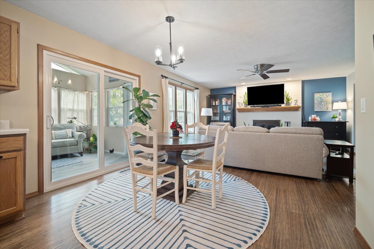 1024 Kings Mill Road Normal, IL 61761 - Photo 9 of 21 a living room with furniture a flat screen tv and kitchen view