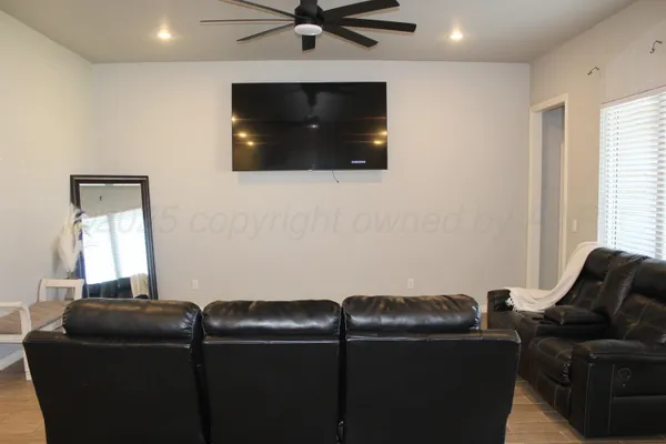 a living room with couch and a flat screen tv