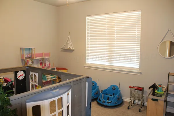 a front view of a house with car parked