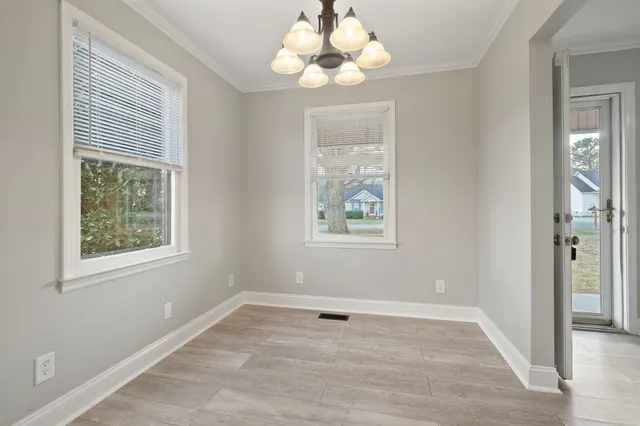 a kitchen with granite countertop a sink stainless steel appliances and cabinets