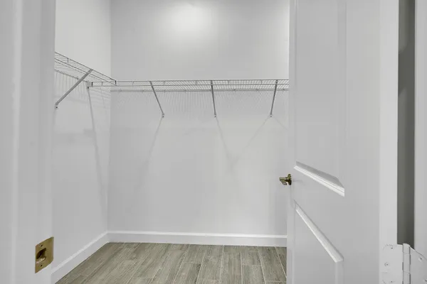 a view of a room with racks on the wall