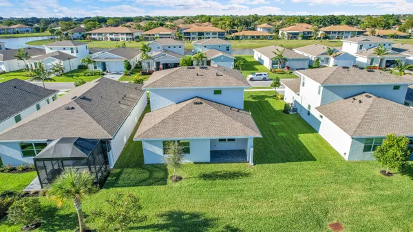 an aerial view of a house with a garden