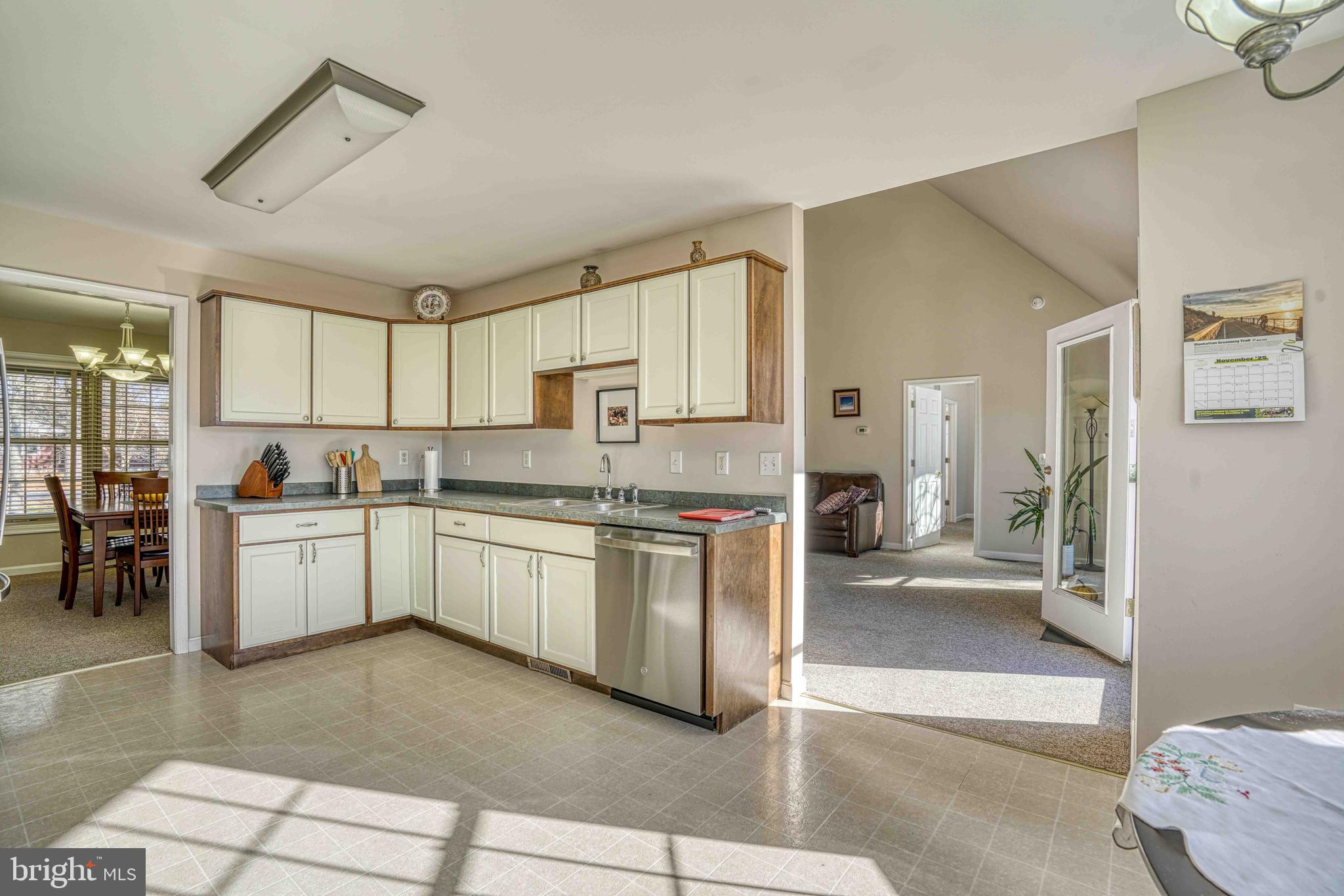 36620 Robin Hood Road Delmar, DE 19940 - Photo 12 of 48 a kitchen with a refrigerator and white cabinets