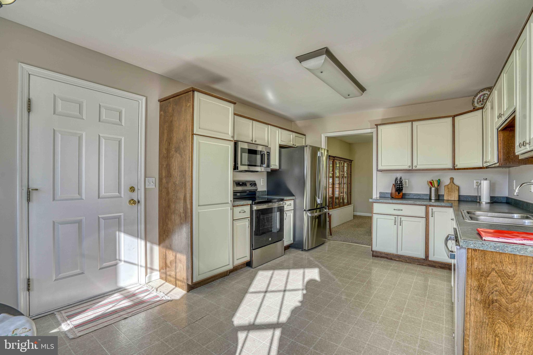 36620 Robin Hood Road Delmar, DE 19940 - Photo 13 of 48 a kitchen with a refrigerator and cabinets