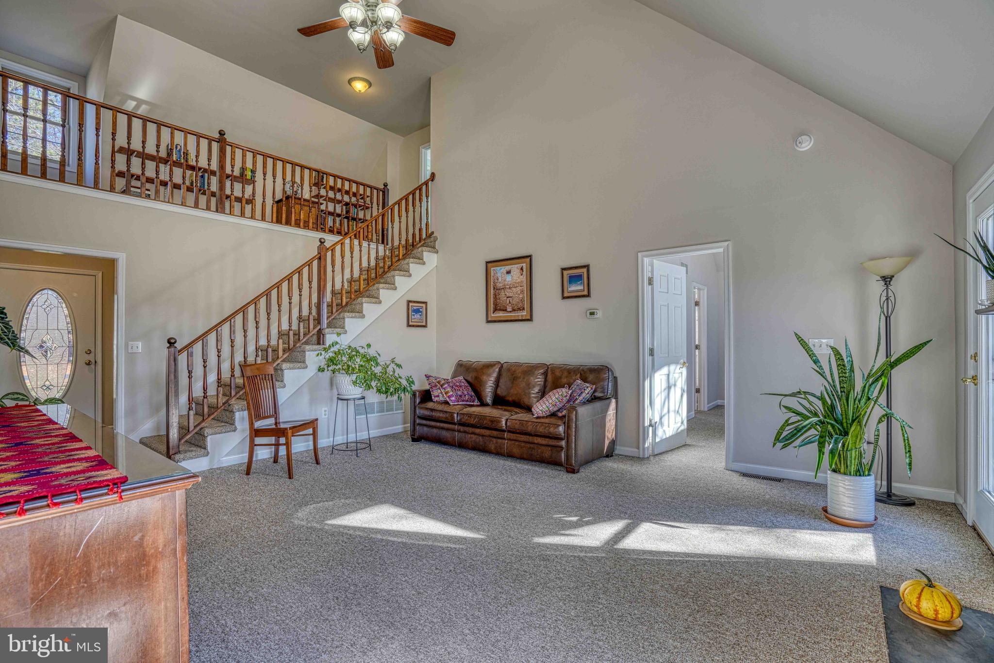 36620 Robin Hood Road Delmar, DE 19940 - Photo 48 of 48 a living room with furniture and a chandelier
