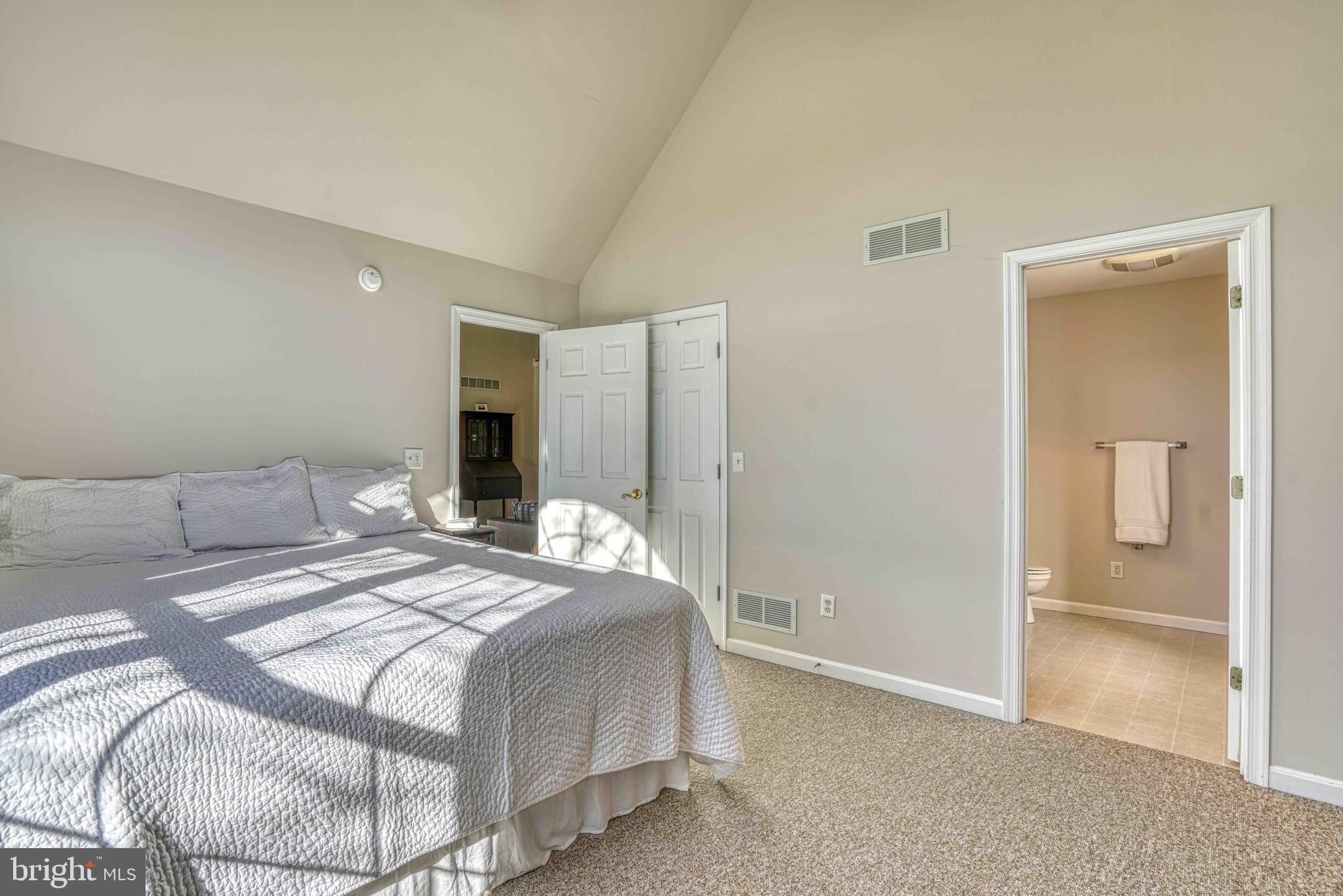 36620 Robin Hood Road Delmar, DE 19940 - Photo 19 of 48 a bedroom with a bed and a table