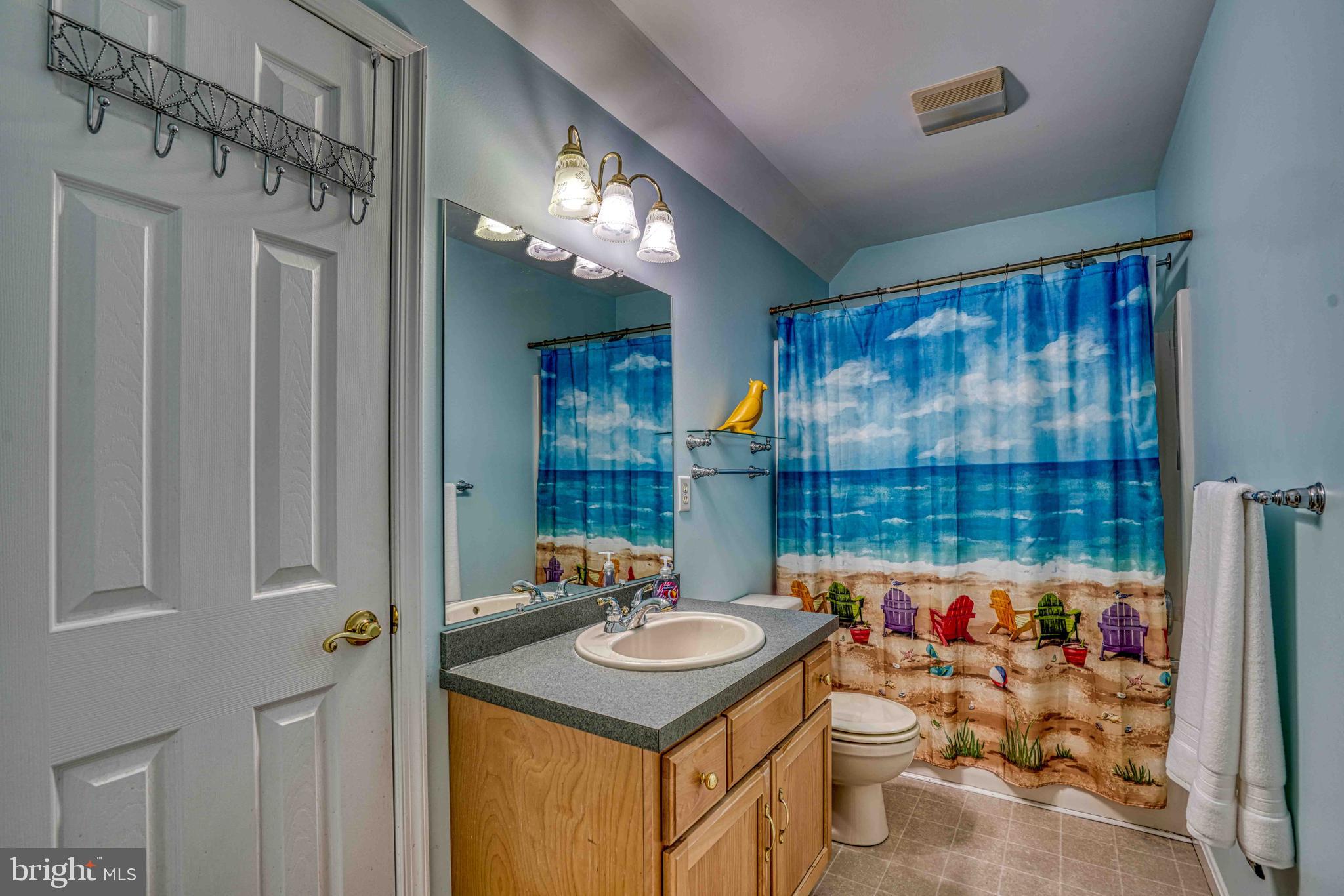 36620 Robin Hood Road Delmar, DE 19940 - Photo 26 of 48 a kitchen with a sink a stove and a refrigerator