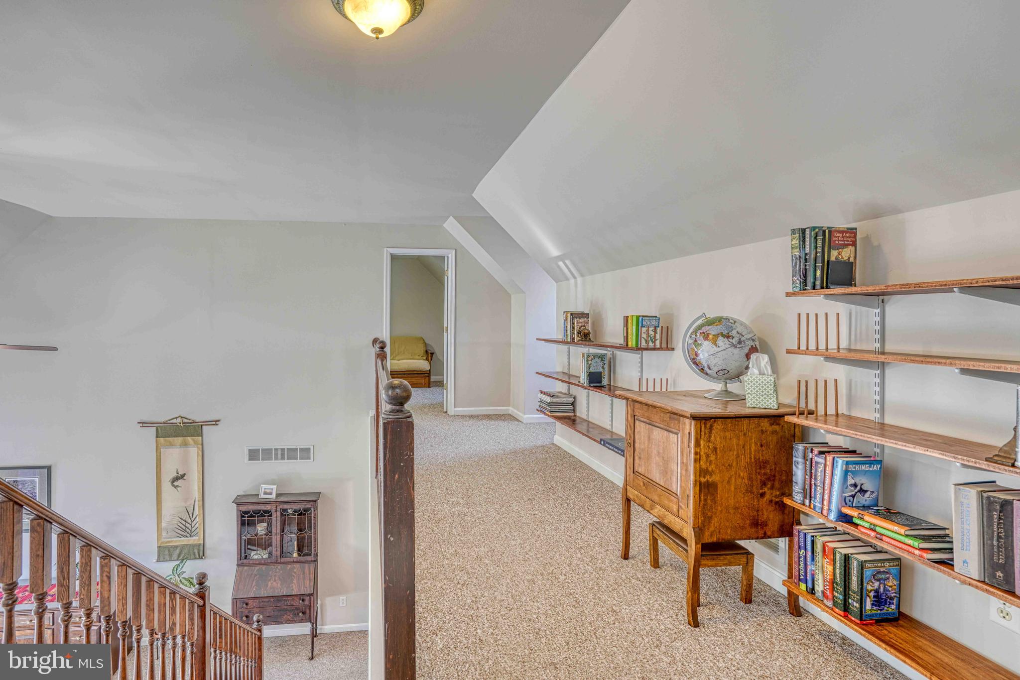 36620 Robin Hood Road Delmar, DE 19940 - Photo 27 of 48 a living room with furniture and a book shelf