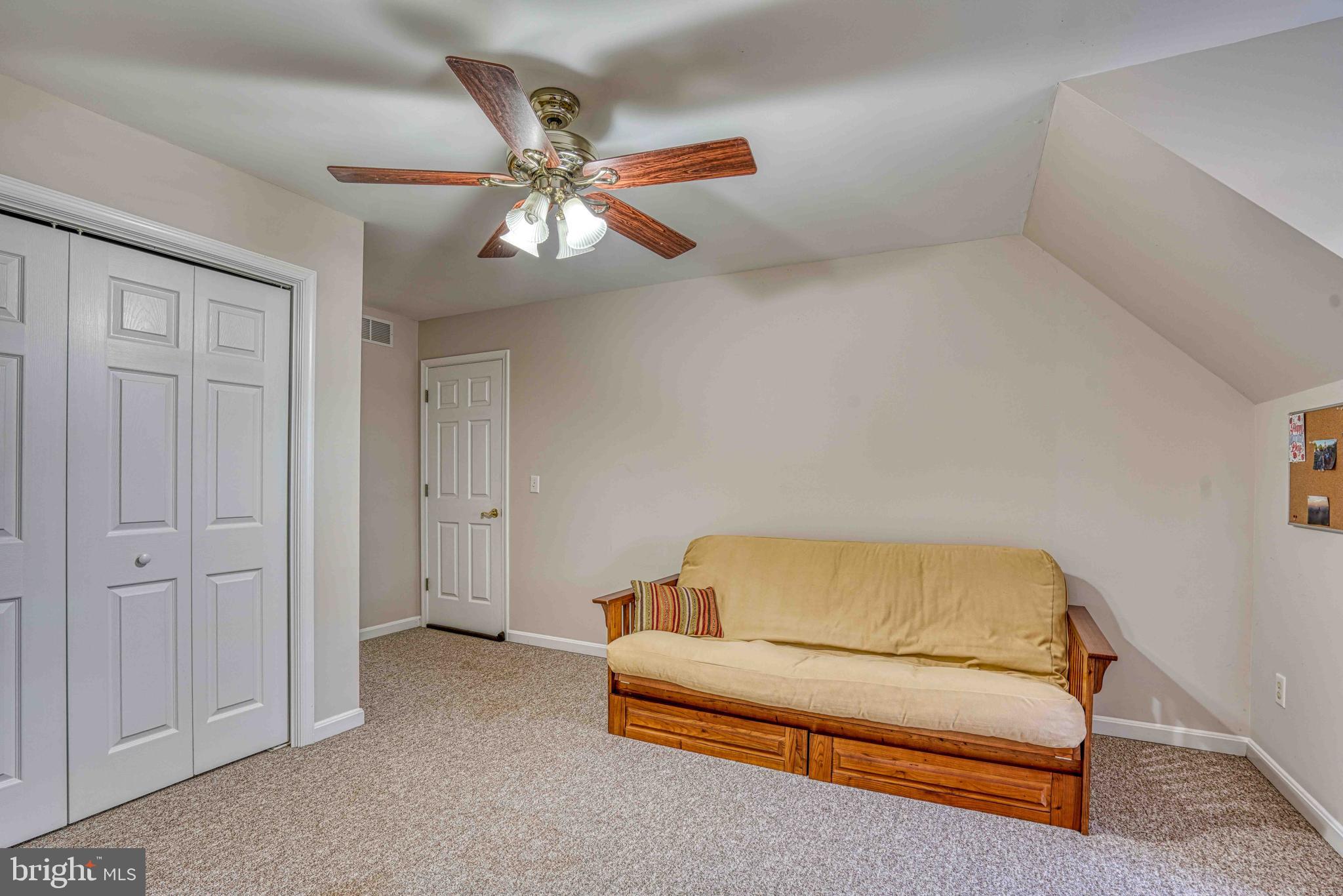 36620 Robin Hood Road Delmar, DE 19940 - Photo 30 of 48 a living room with furniture and a ceiling fan
