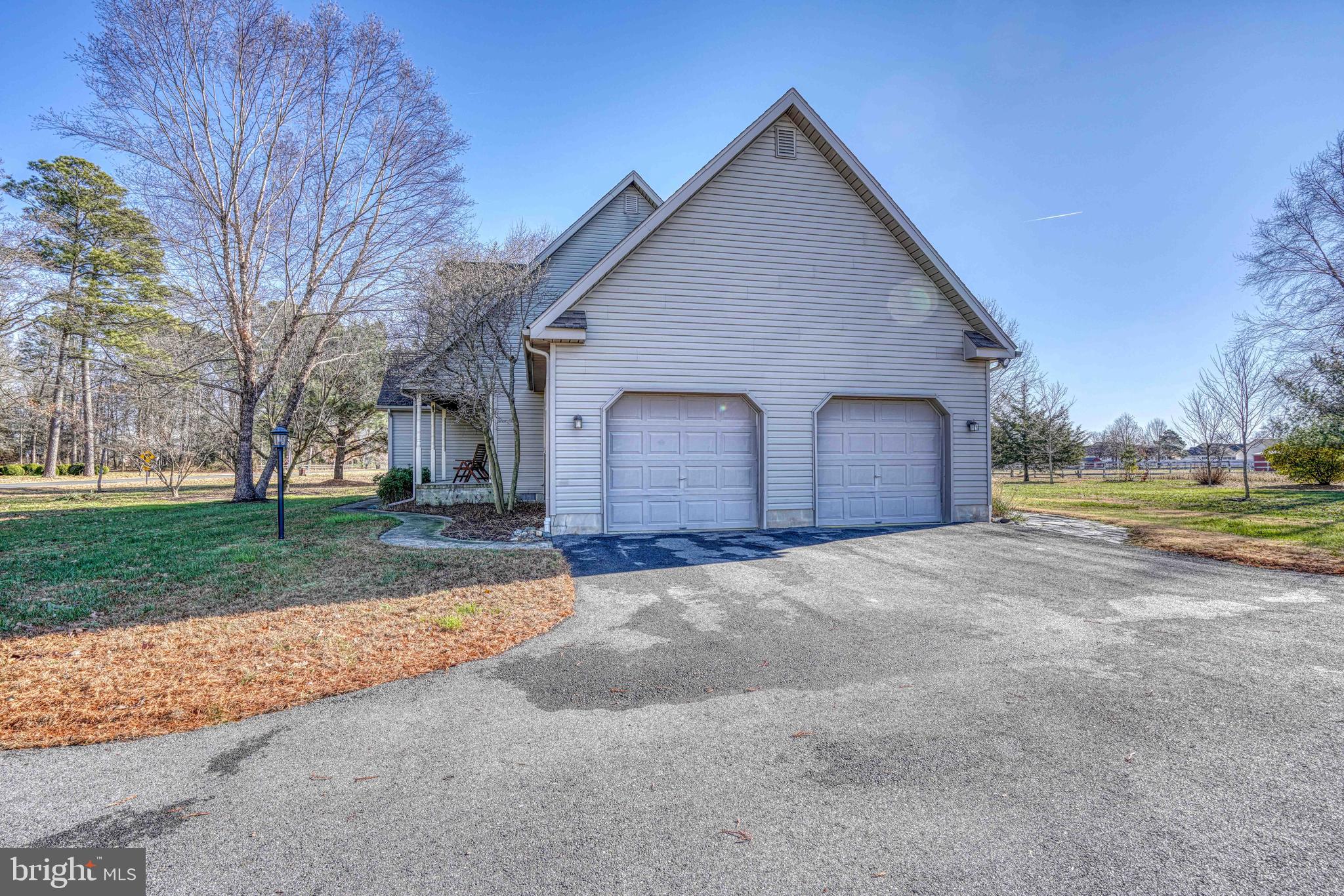 36620 Robin Hood Road Delmar, DE 19940 - Photo 45 of 48 a view of a house with a yard and garage