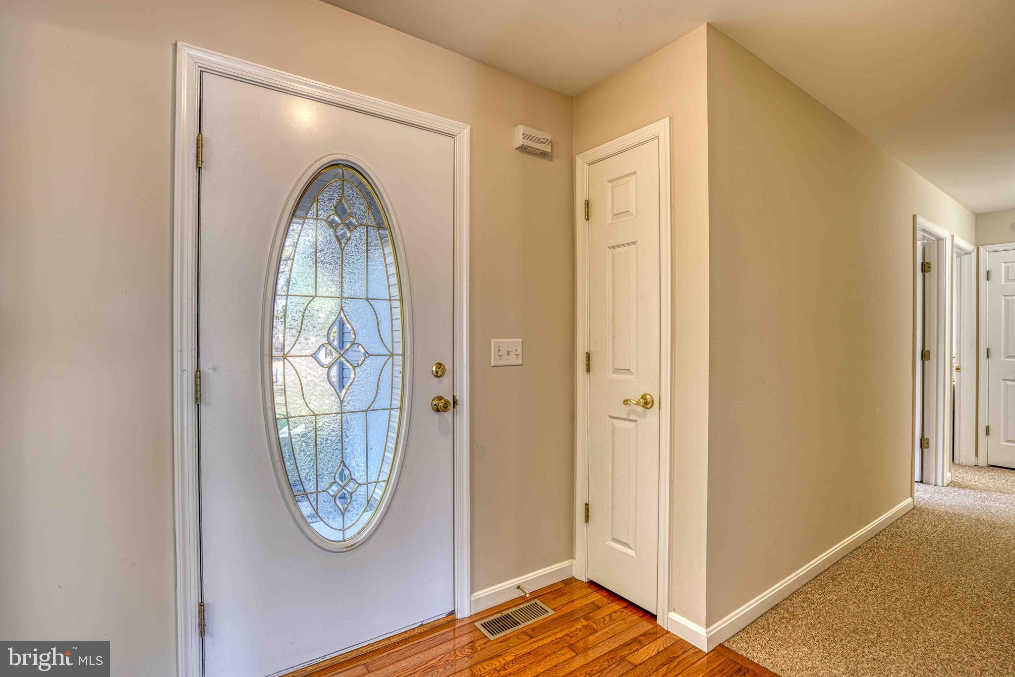 36620 Robin Hood Road Delmar, DE 19940 - Photo 6 of 48 a view of a livingroom with wooden floor and entryway