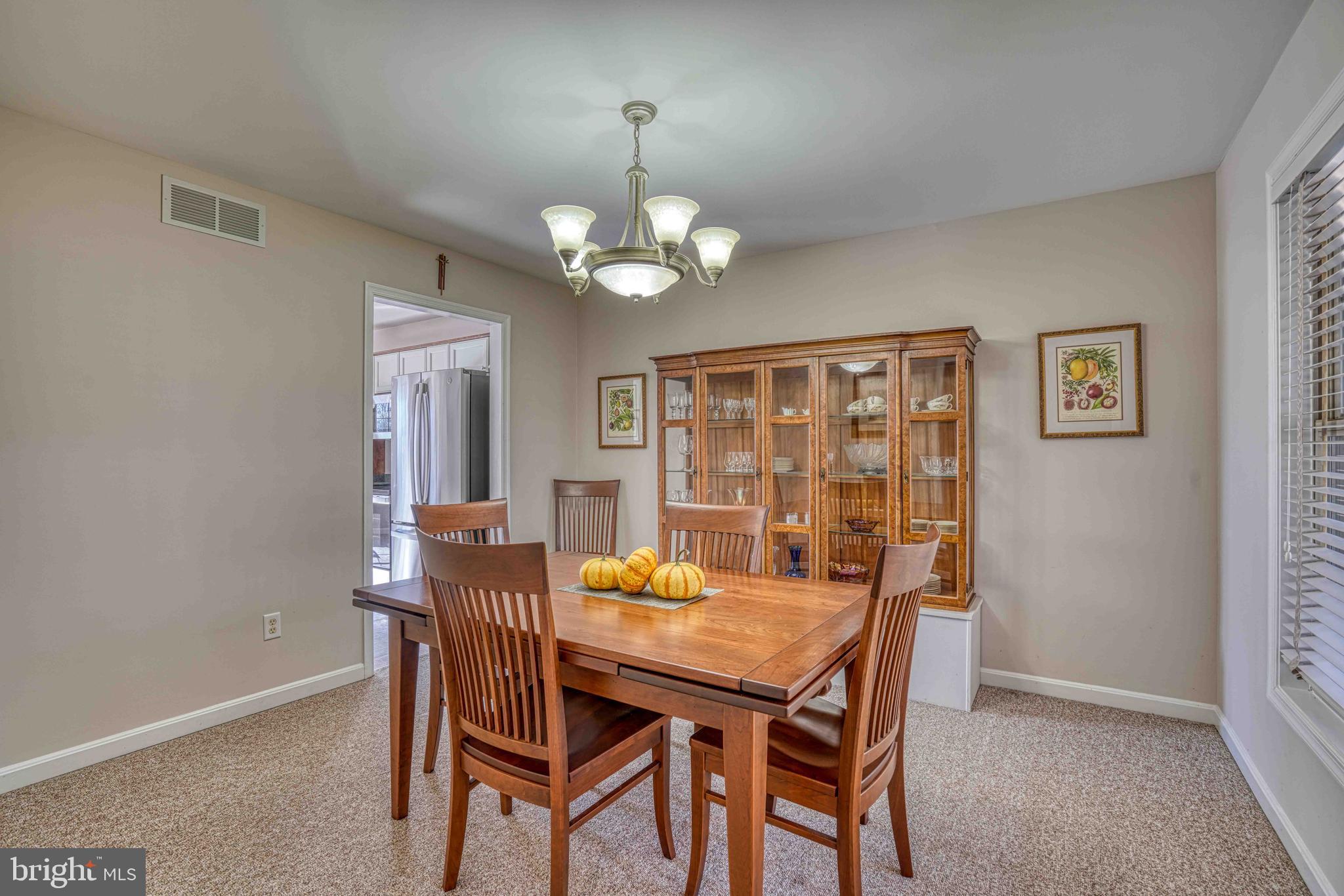 36620 Robin Hood Road Delmar, DE 19940 - Photo 7 of 48 a view of a dining room with furniture and chandelier