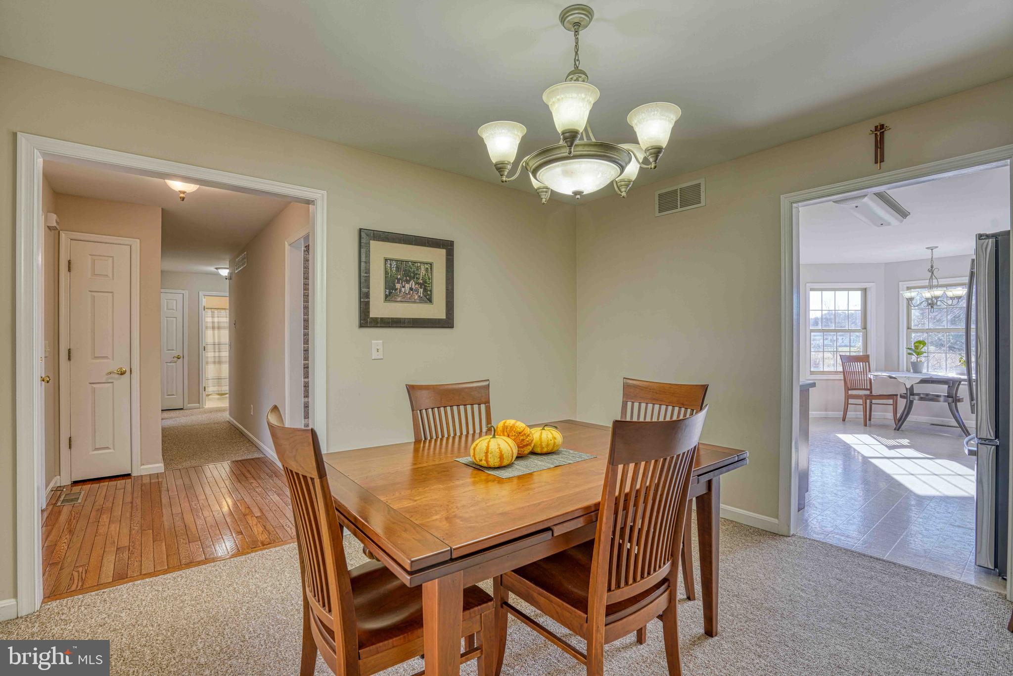 36620 Robin Hood Road Delmar, DE 19940 - Photo 8 of 48 a view of a dining room with furniture and wooden floor