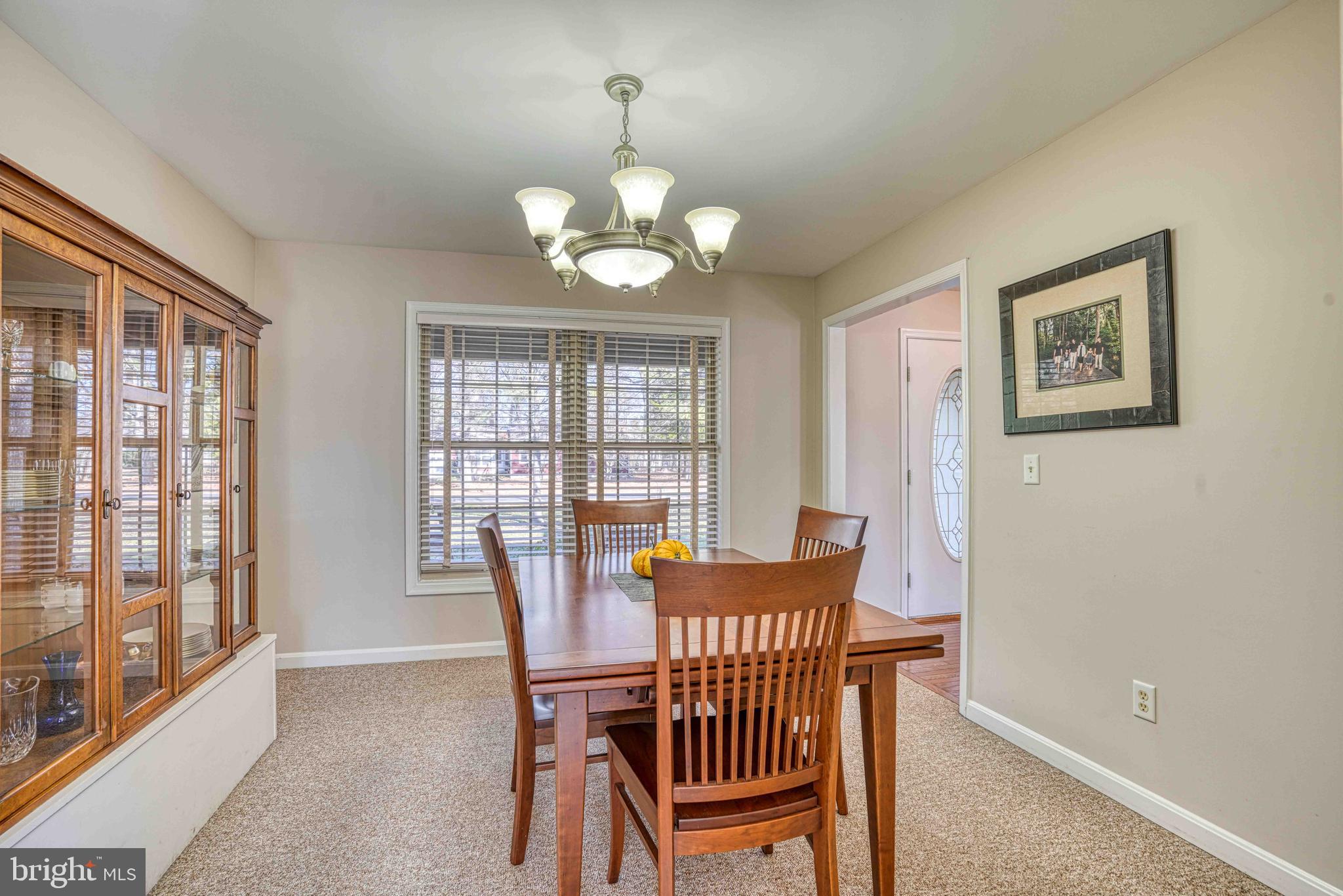 36620 Robin Hood Road Delmar, DE 19940 - Photo 9 of 48 a view of a dining room with furniture wooden floor and chandelier