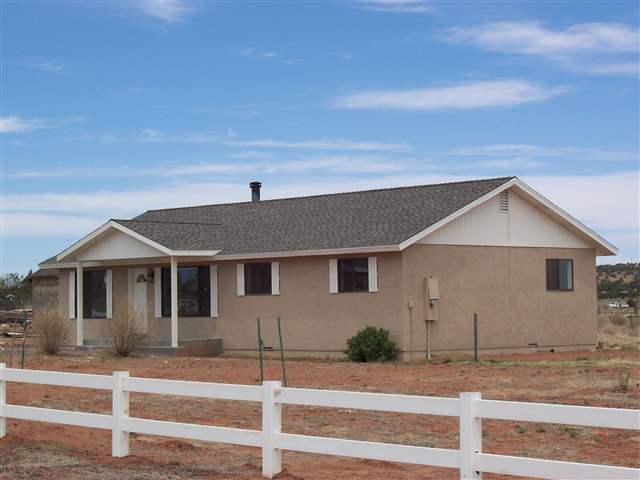 2301 West N 7th Snowflake, AZ 85937 - Photo 1 of 9 a front view of a house with a yard