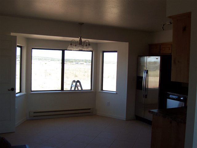 2301 West N 7th Snowflake, AZ 85937 - Photo 5 of 9 an empty room with a window