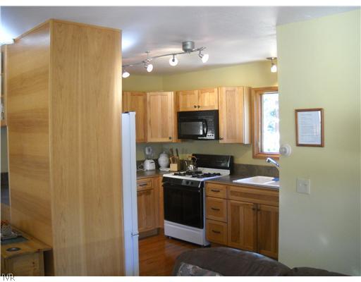 1329 Thurgau Court Incline Village, NV 89451 - Photo 4 of 11 a kitchen with cabinets and stainless steel appliances