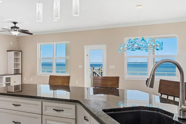 a kitchen with stainless steel appliances granite countertop a stove a sink and dishwasher