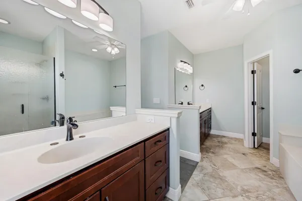 a bathroom with a sink double vanity and a mirror