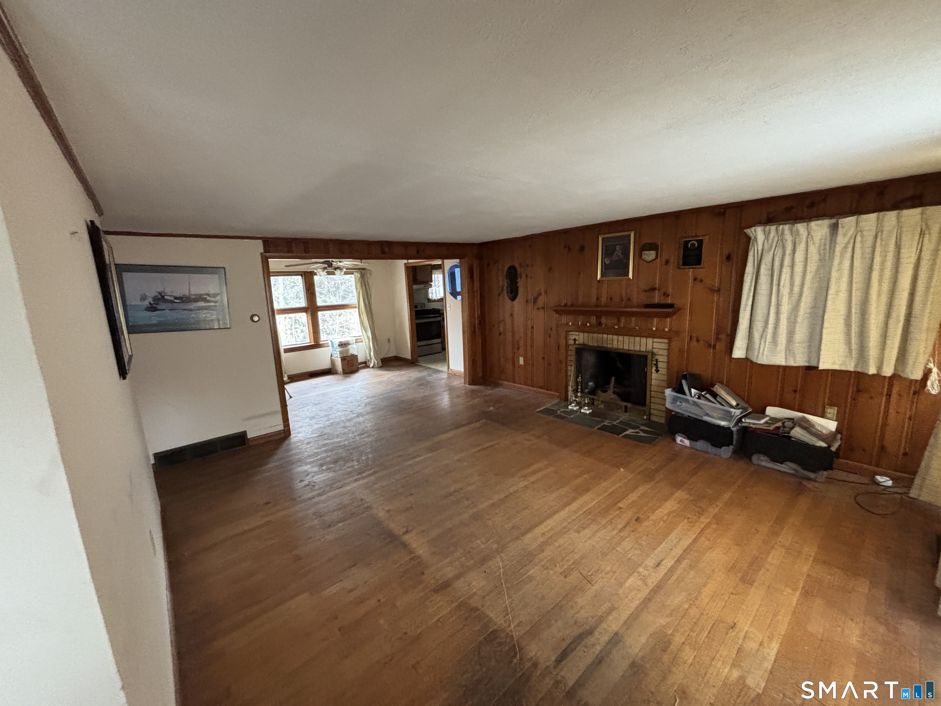 44 Upper State Street North Haven, CT 06473 - Photo 4 of 11 an empty room with furniture and a fireplace