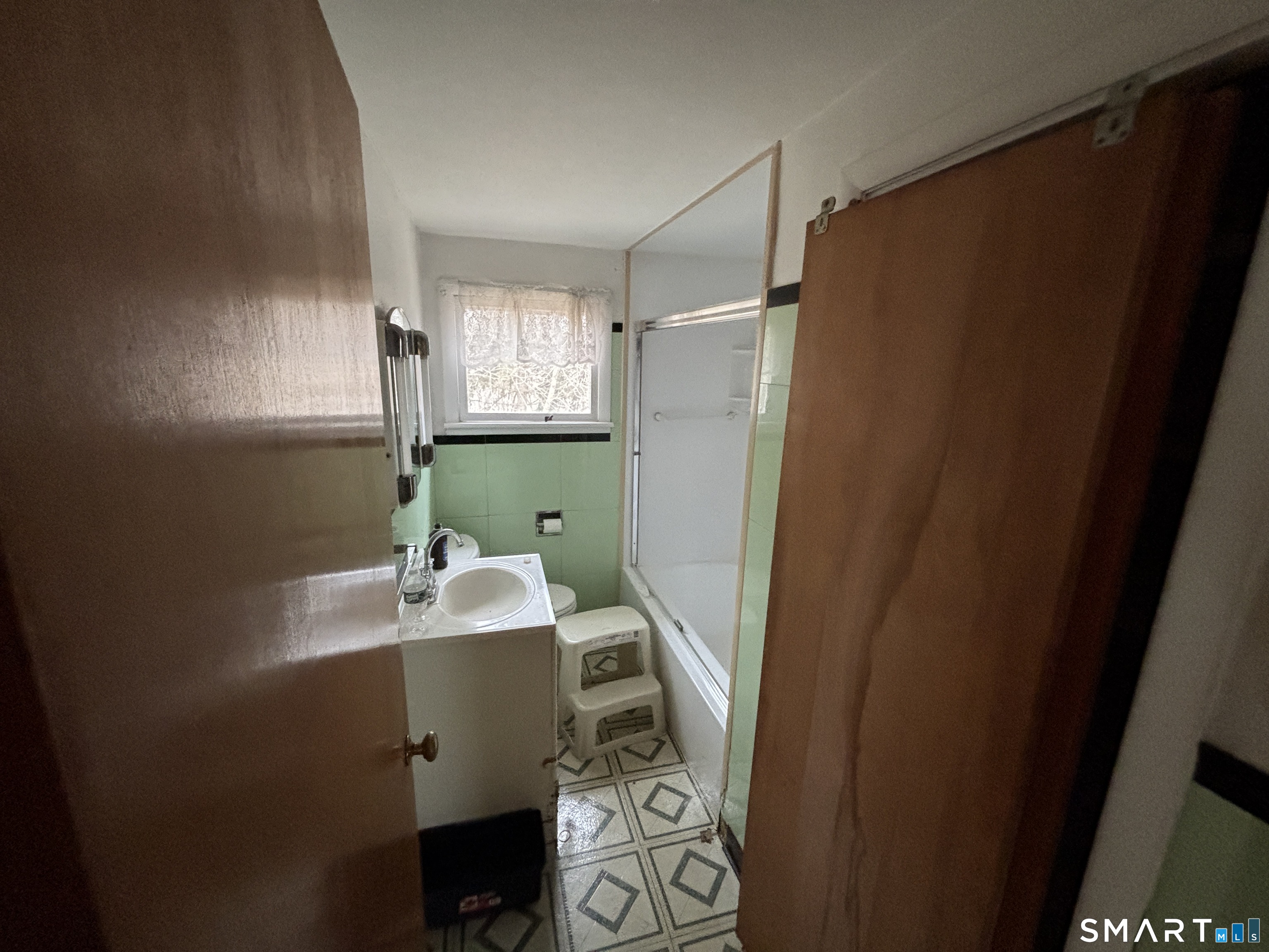 44 Upper State Street North Haven, CT 06473 - Photo 5 of 11 a bathroom with a sink toilet and mirror