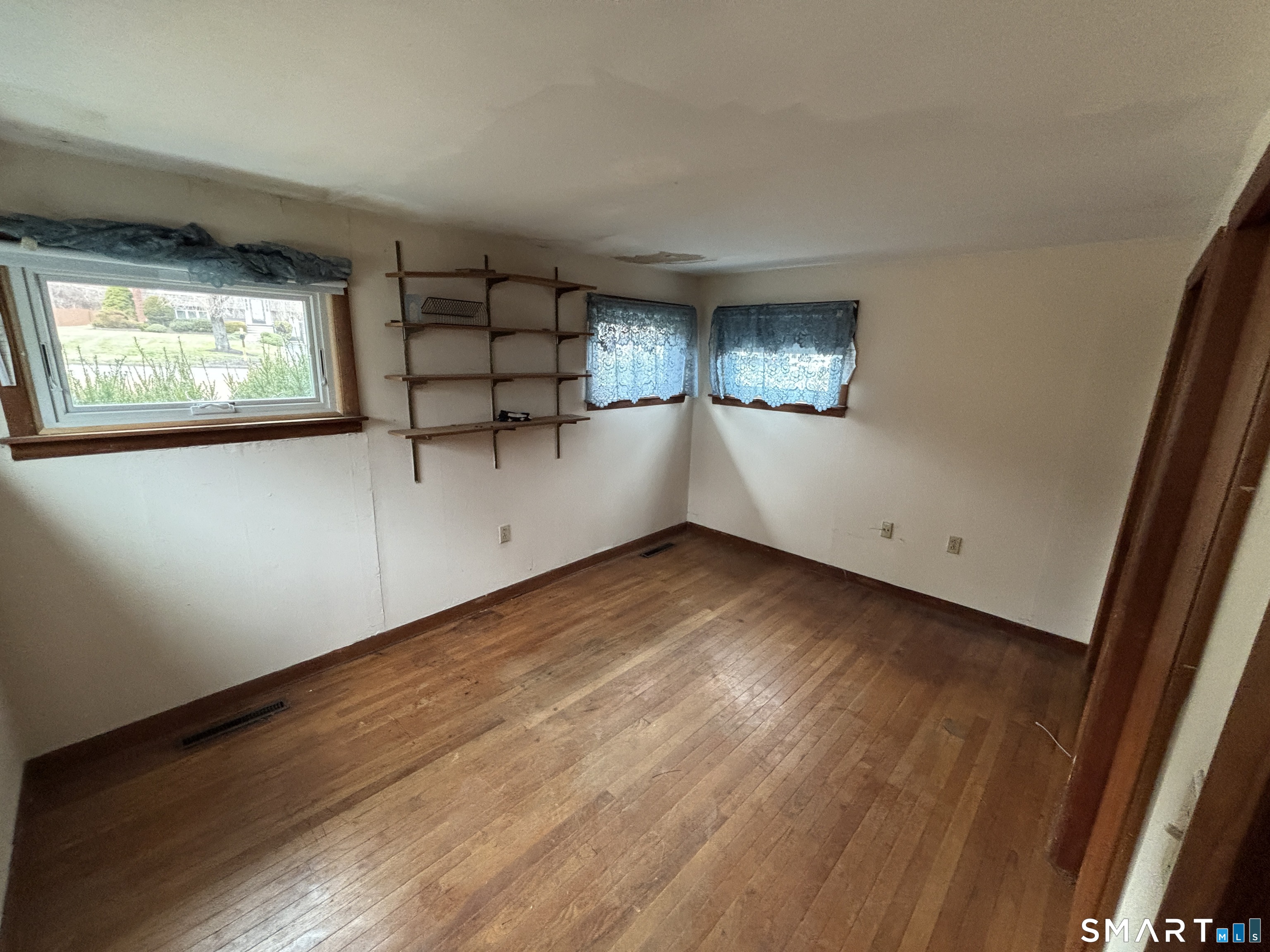44 Upper State Street North Haven, CT 06473 - Photo 6 of 11 wooden floor in an empty room with a window