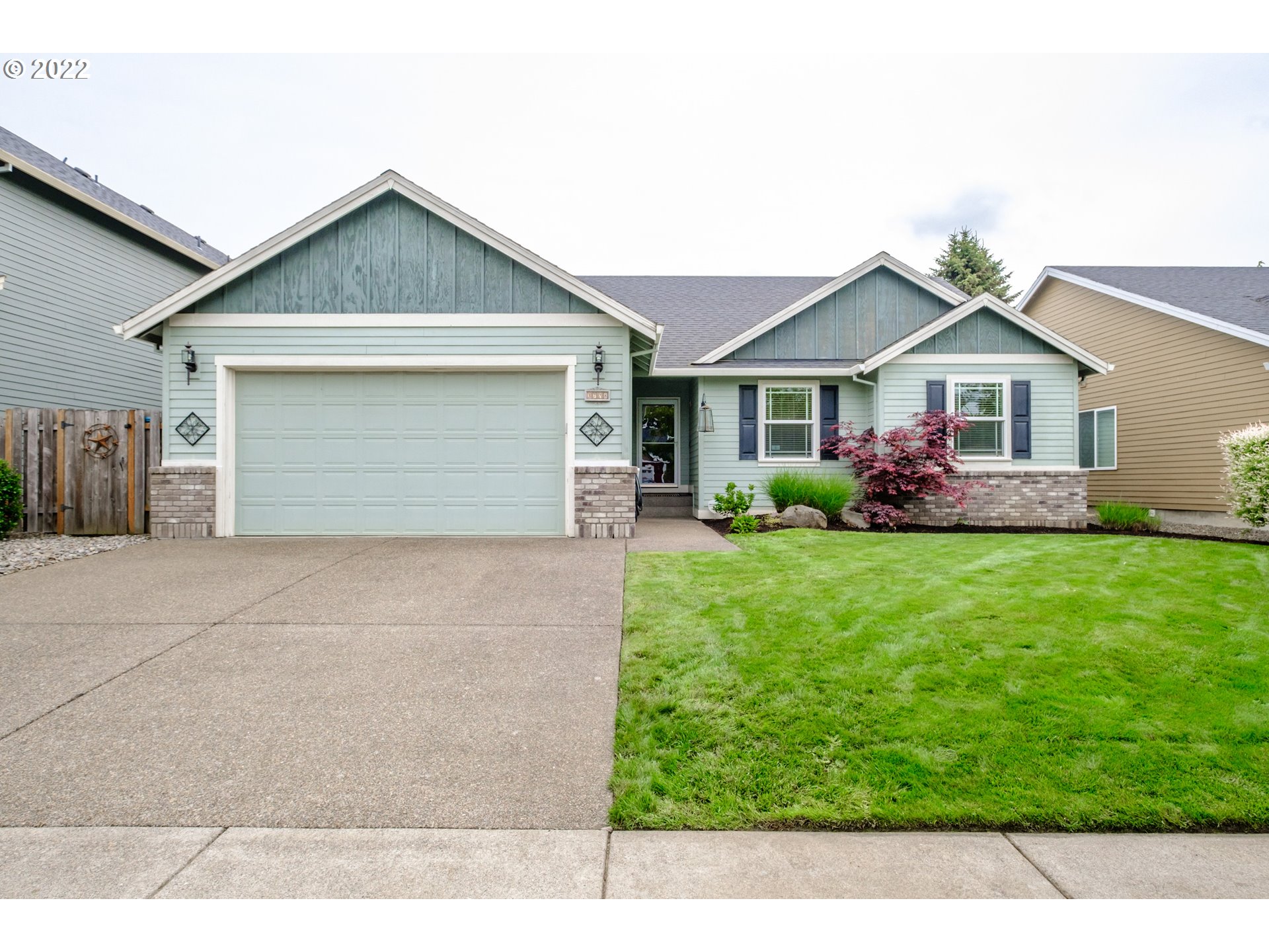 3778 10th Street Hubbard, OR 97032 - Photo 1 of 32 a front view of house with yard and green space