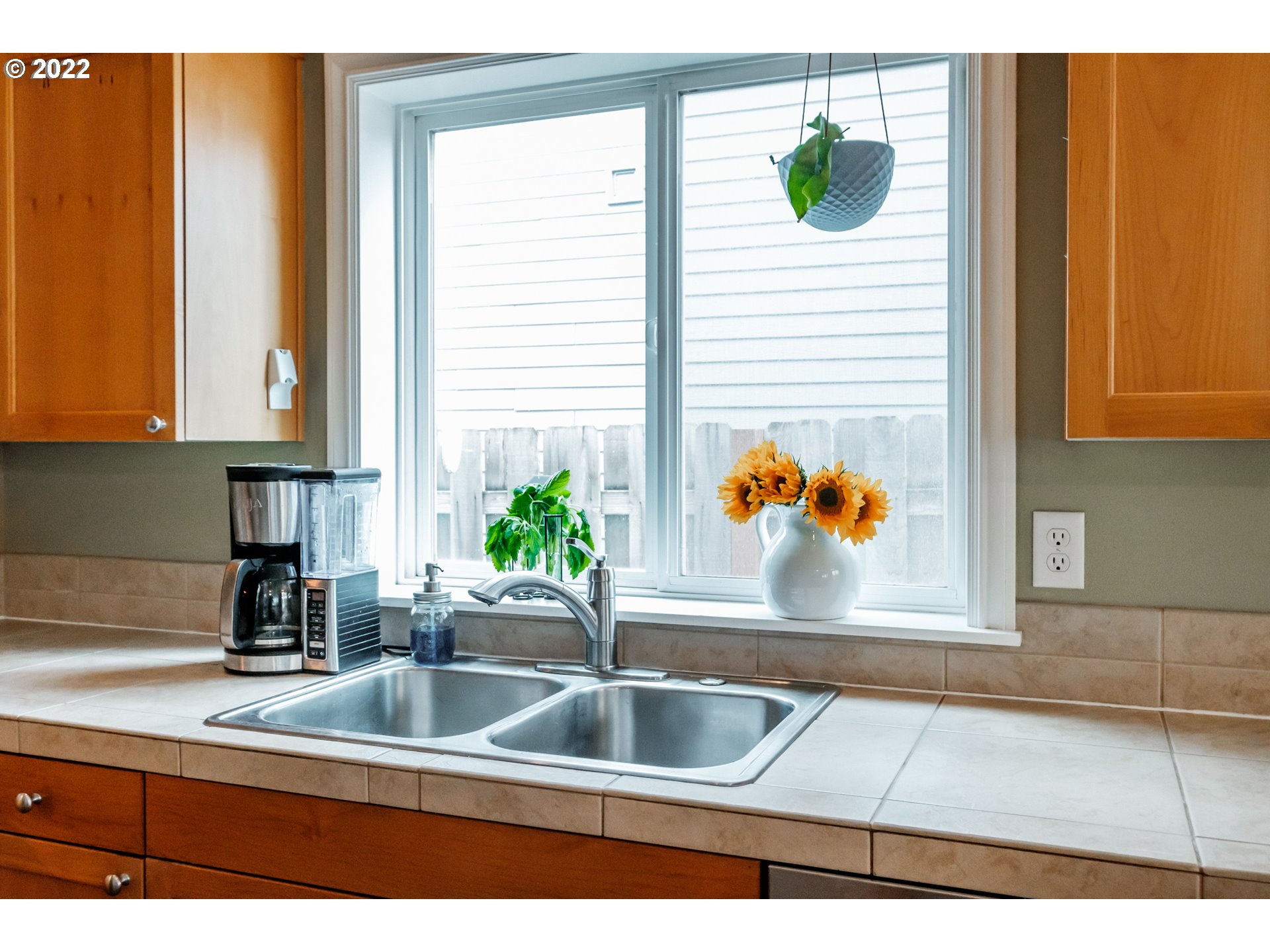 3778 10th Street Hubbard, OR 97032 - Photo 13 of 32 a kitchen with a sink and a window