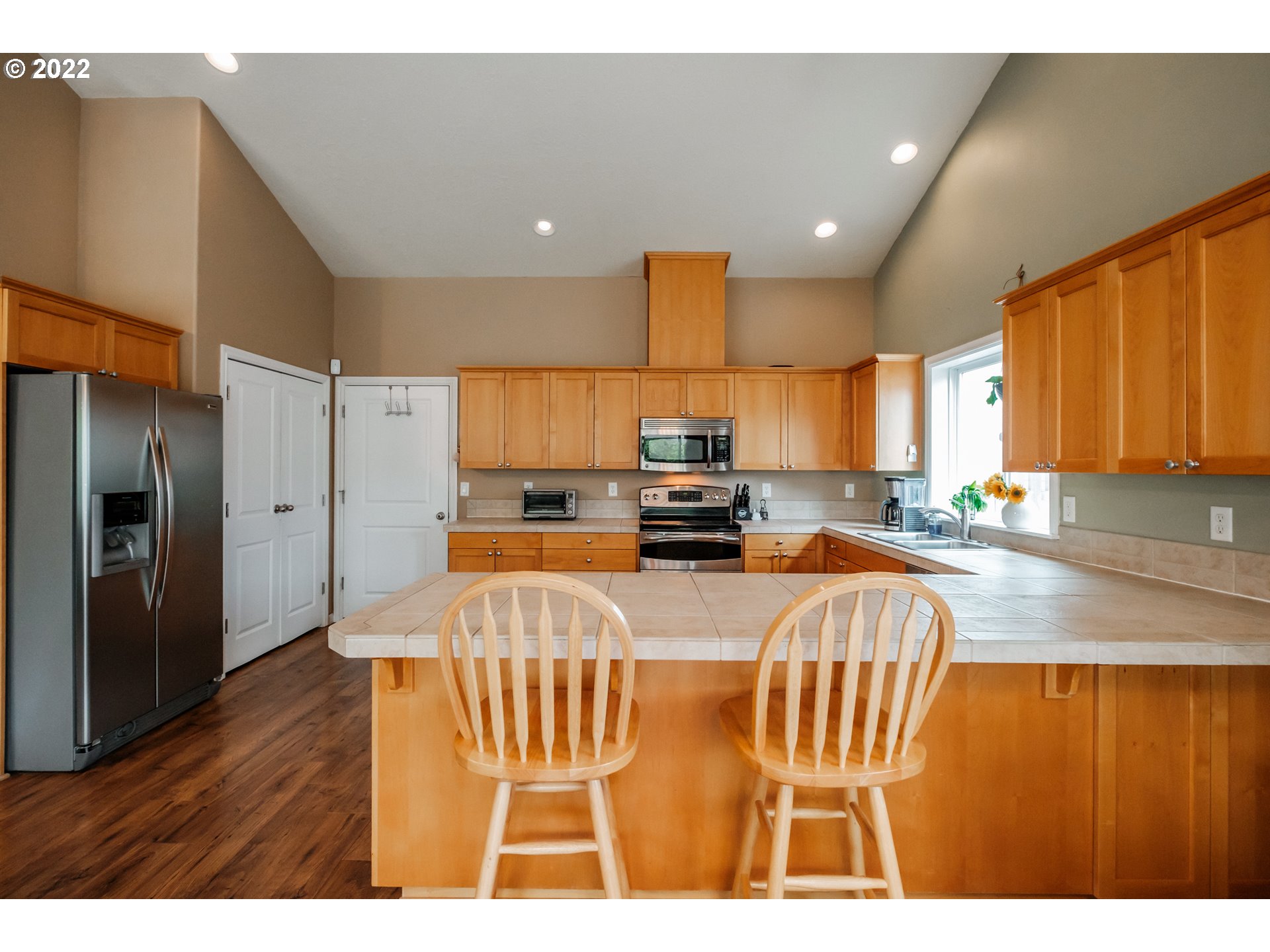 3778 10th Street Hubbard, OR 97032 - Photo 14 of 32 a view of kitchen with stainless steel appliances granite countertop lots of counter top space