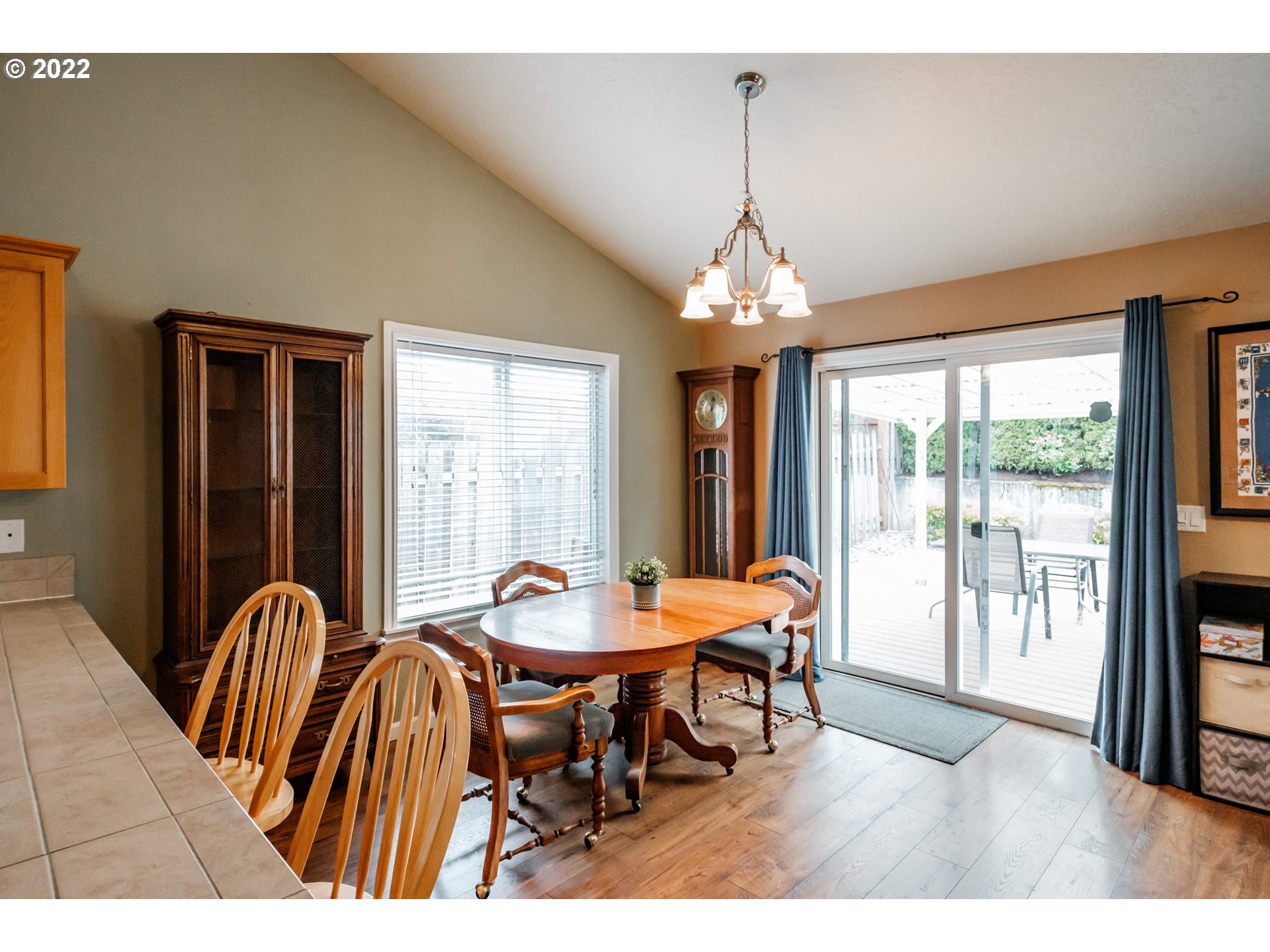 3778 10th Street Hubbard, OR 97032 - Photo 15 of 32 a dining room with furniture a chandelier and wooden floor