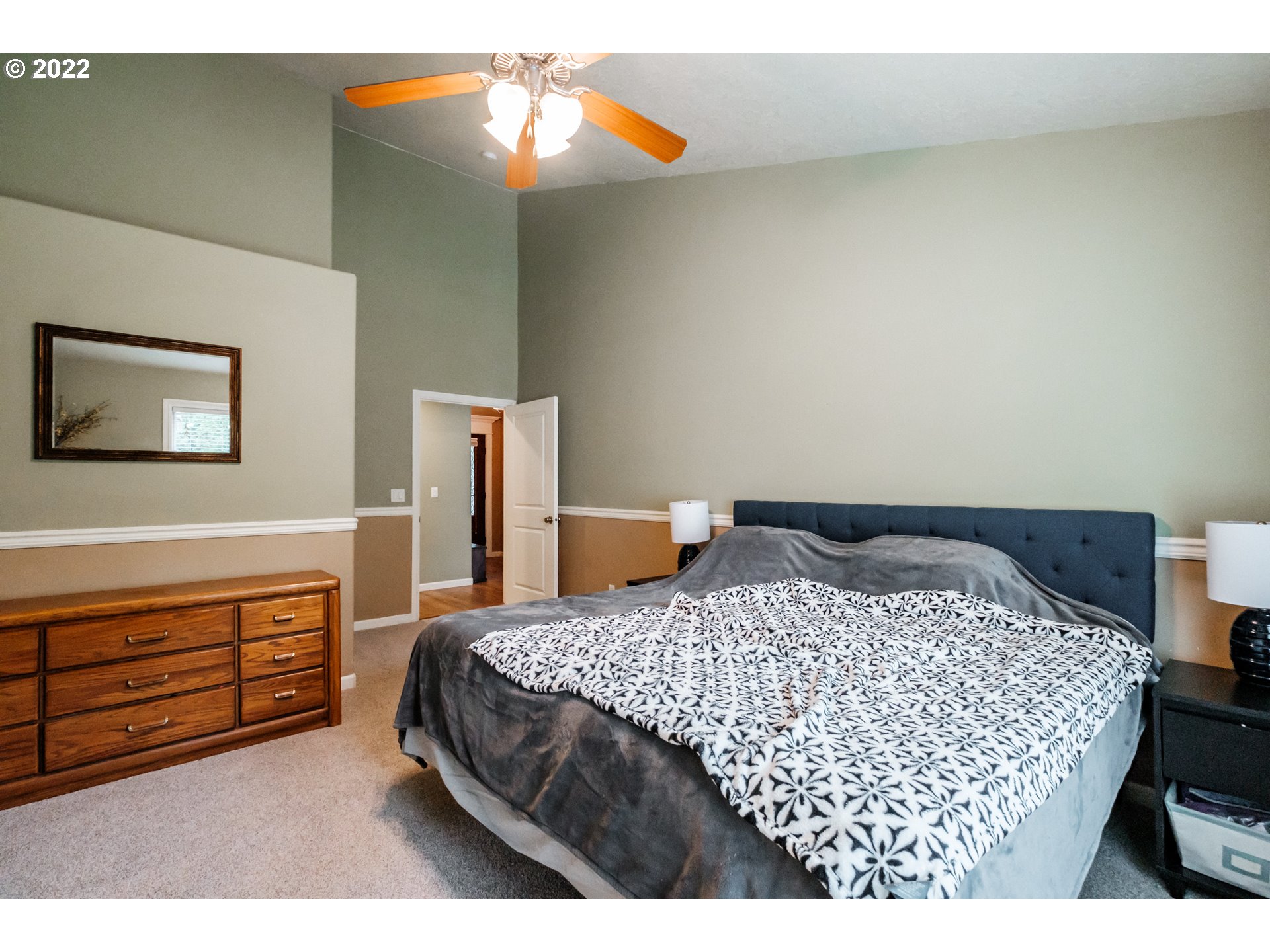 3778 10th Street Hubbard, OR 97032 - Photo 18 of 32 a bedroom with a bed and a cabinets