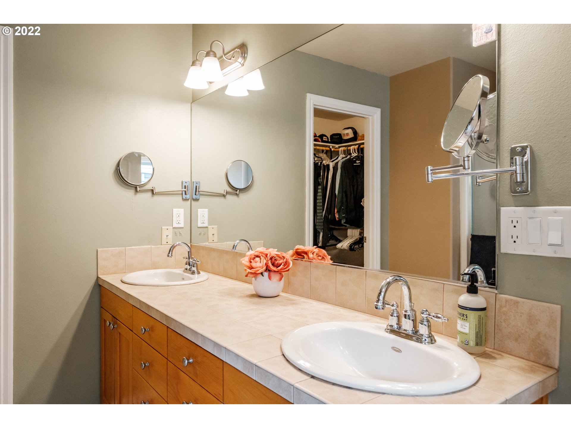 3778 10th Street Hubbard, OR 97032 - Photo 20 of 32 a bathroom with a sink and a mirror
