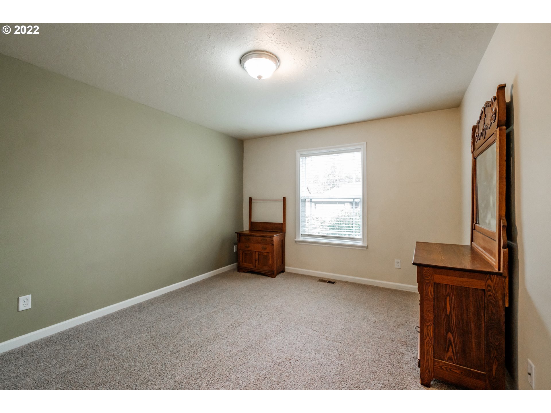 3778 10th Street Hubbard, OR 97032 - Photo 23 of 32 a view of an empty room with a window