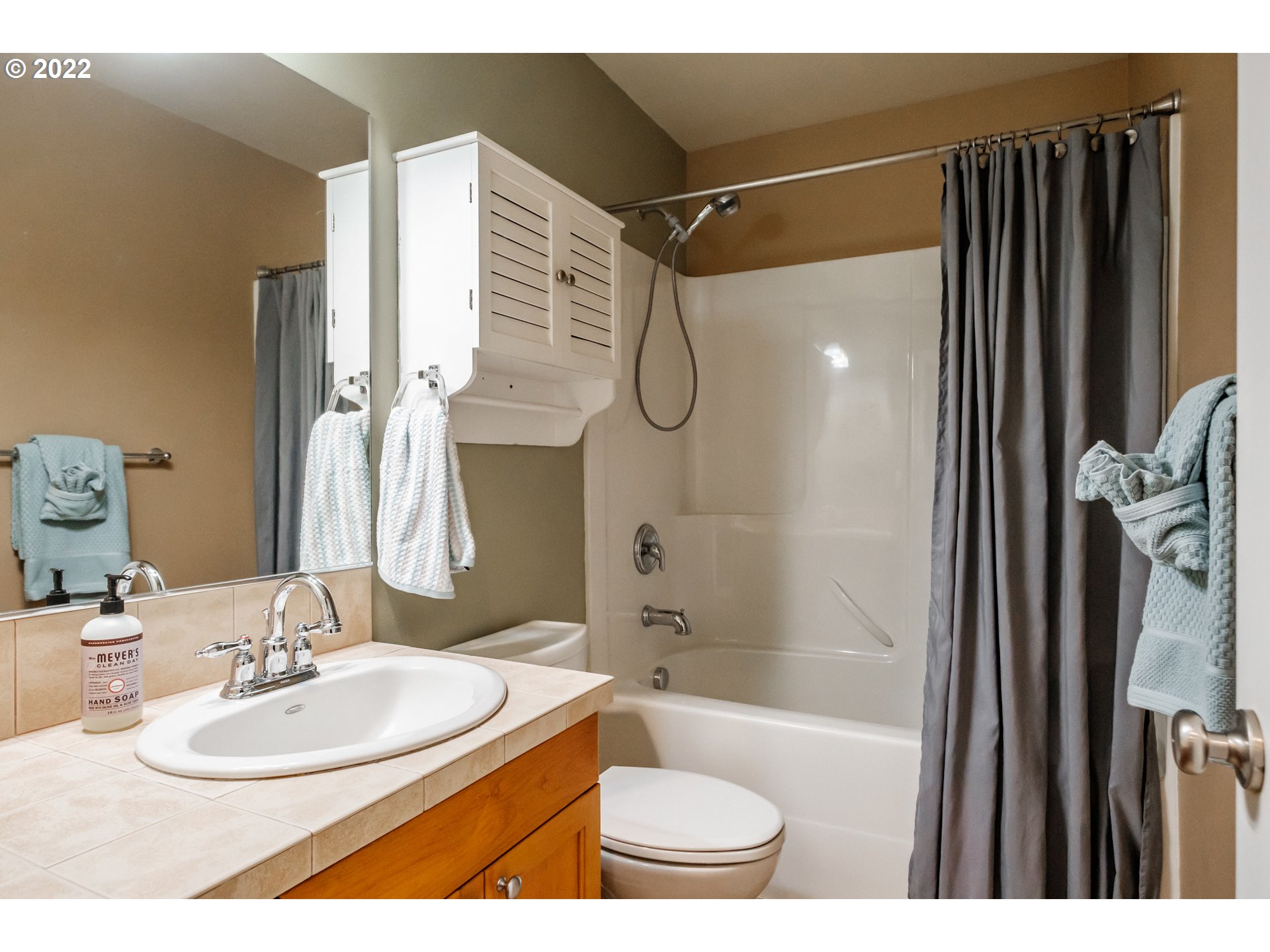 3778 10th Street Hubbard, OR 97032 - Photo 25 of 32 a bathroom with a sink toilet and shower