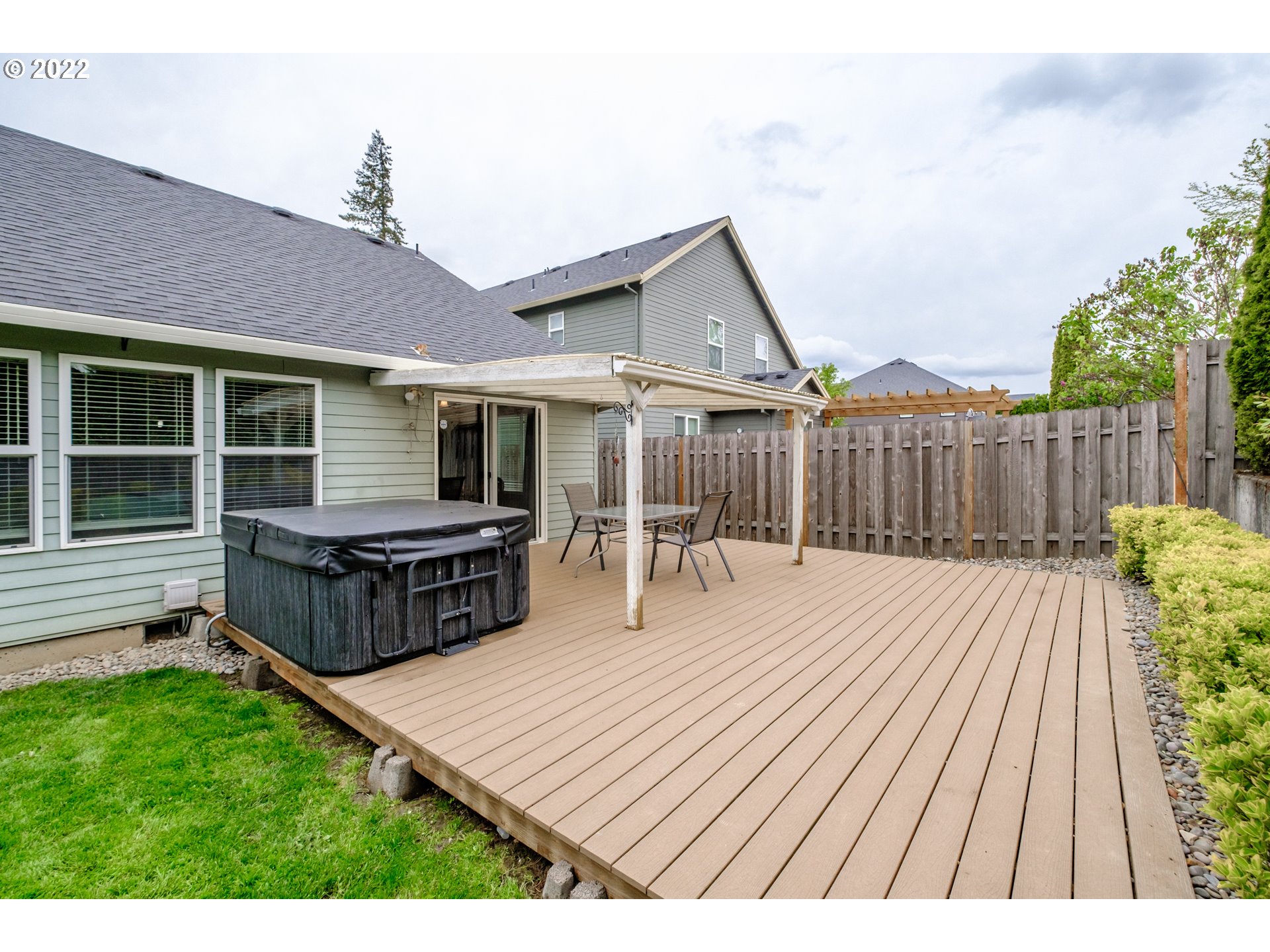 3778 10th Street Hubbard, OR 97032 - Photo 28 of 32 a view of a house with wooden deck and furniture