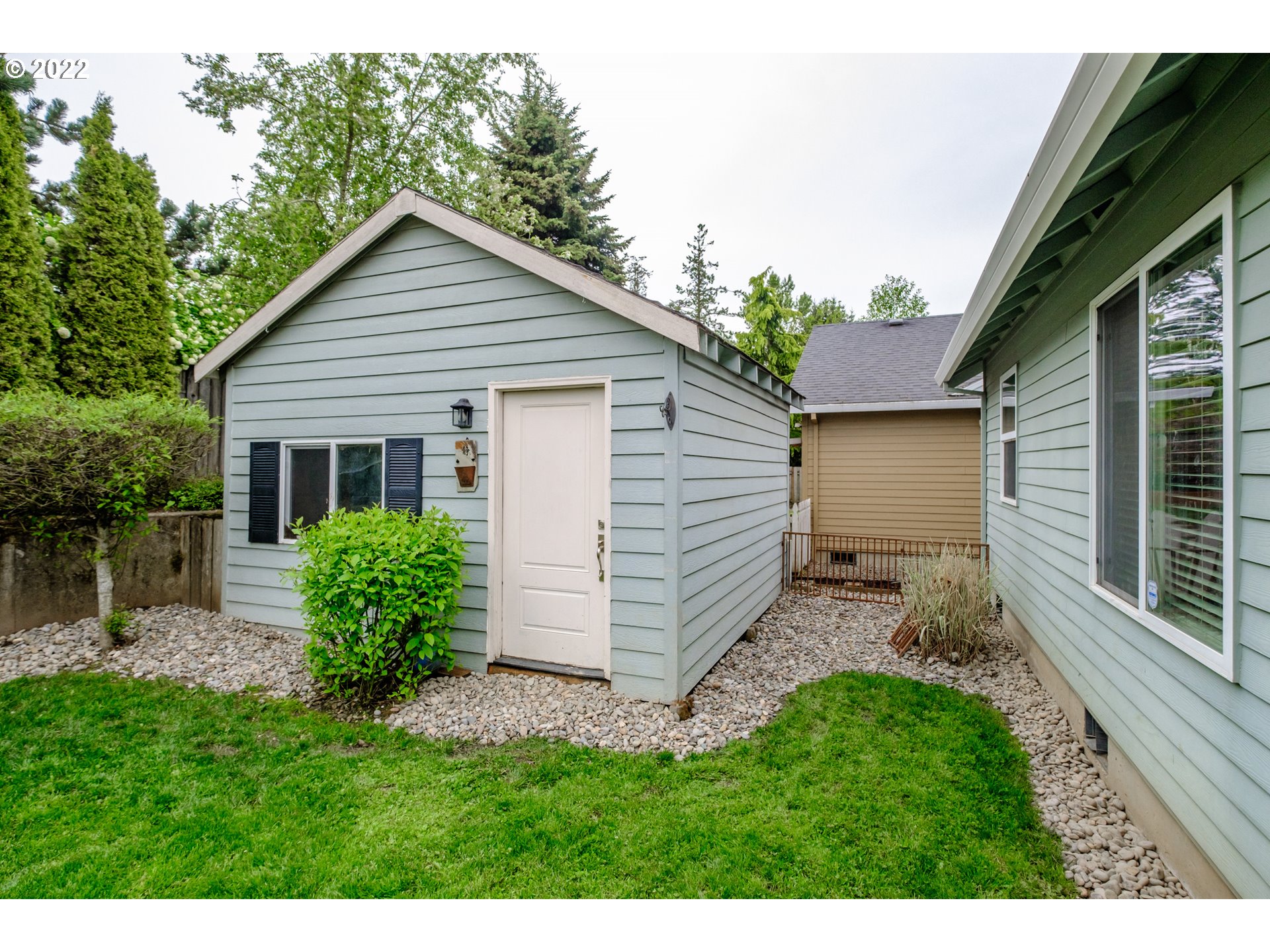 3778 10th Street Hubbard, OR 97032 - Photo 30 of 32 a view of a house with a yard plants and large tree