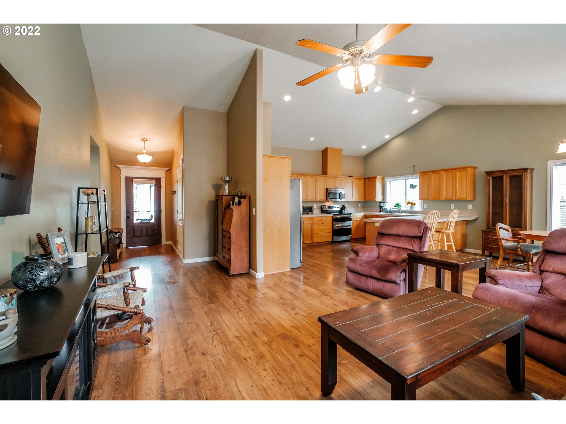 3778 10th Street Hubbard, OR 97032 - Photo 7 of 32 a living room with furniture kitchen view and a flat screen tv