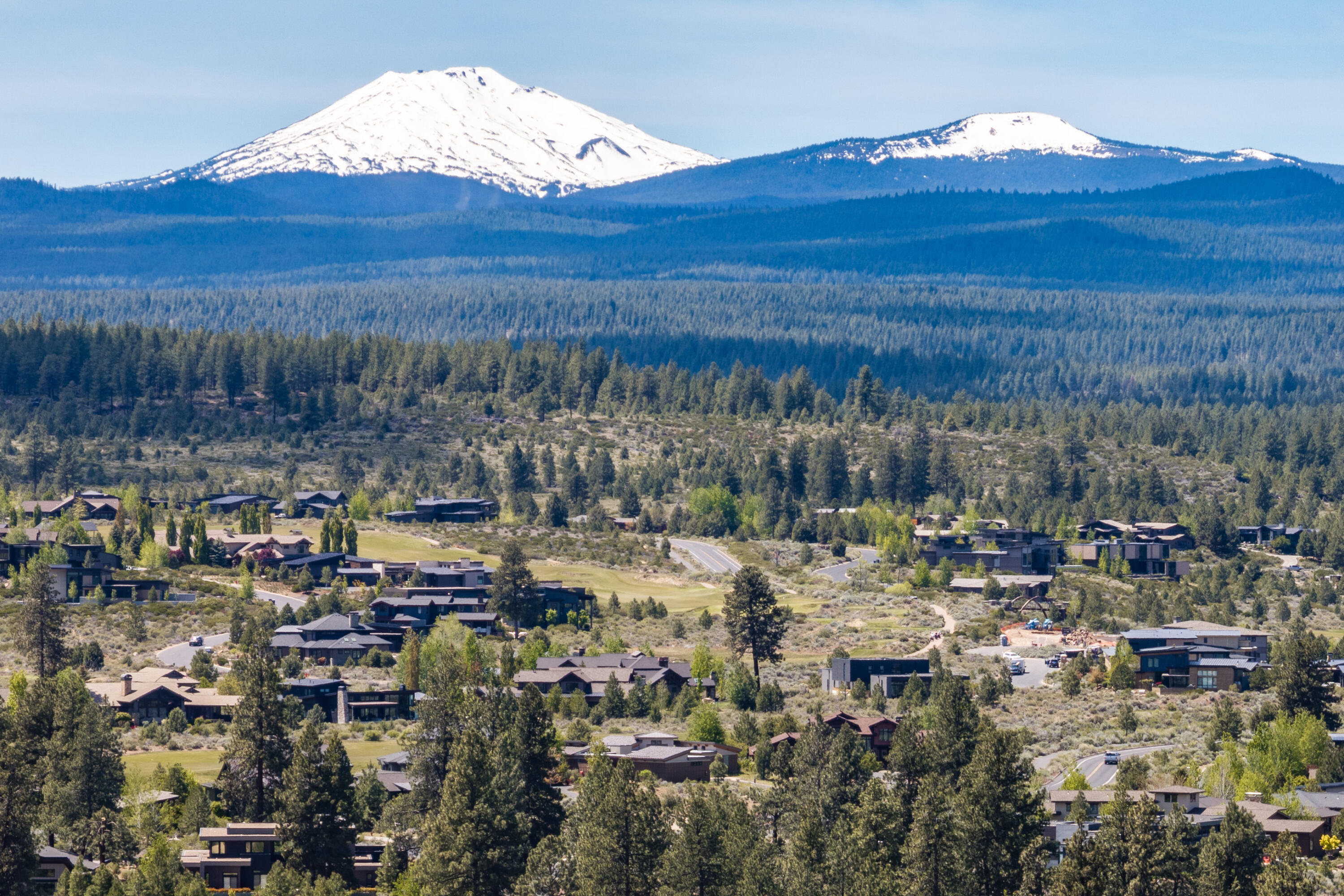 19307 Blue Lake Loop Bend, OR 97702 - Photo 47 of 58 a view of a town with mountains in the background