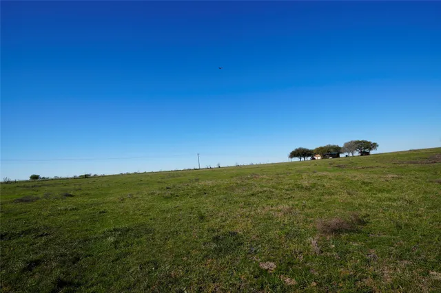 a view of a lake with a yard