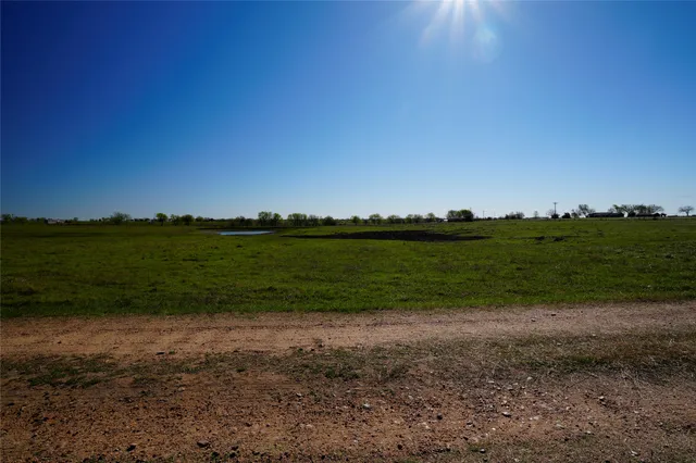 a view of a lake with a big yard