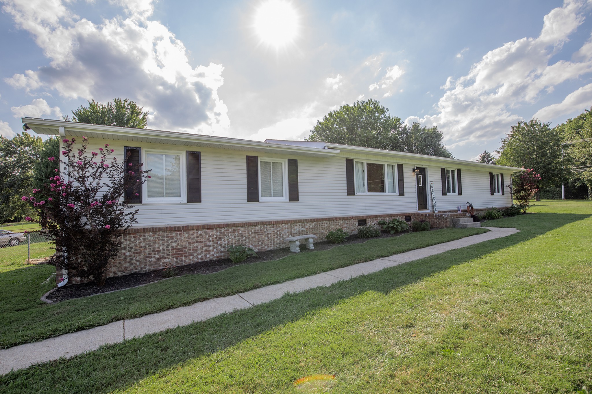 385 Lee Road Cottontown, TN 37048 - Photo 1 of 34 a front view of a house with a yard