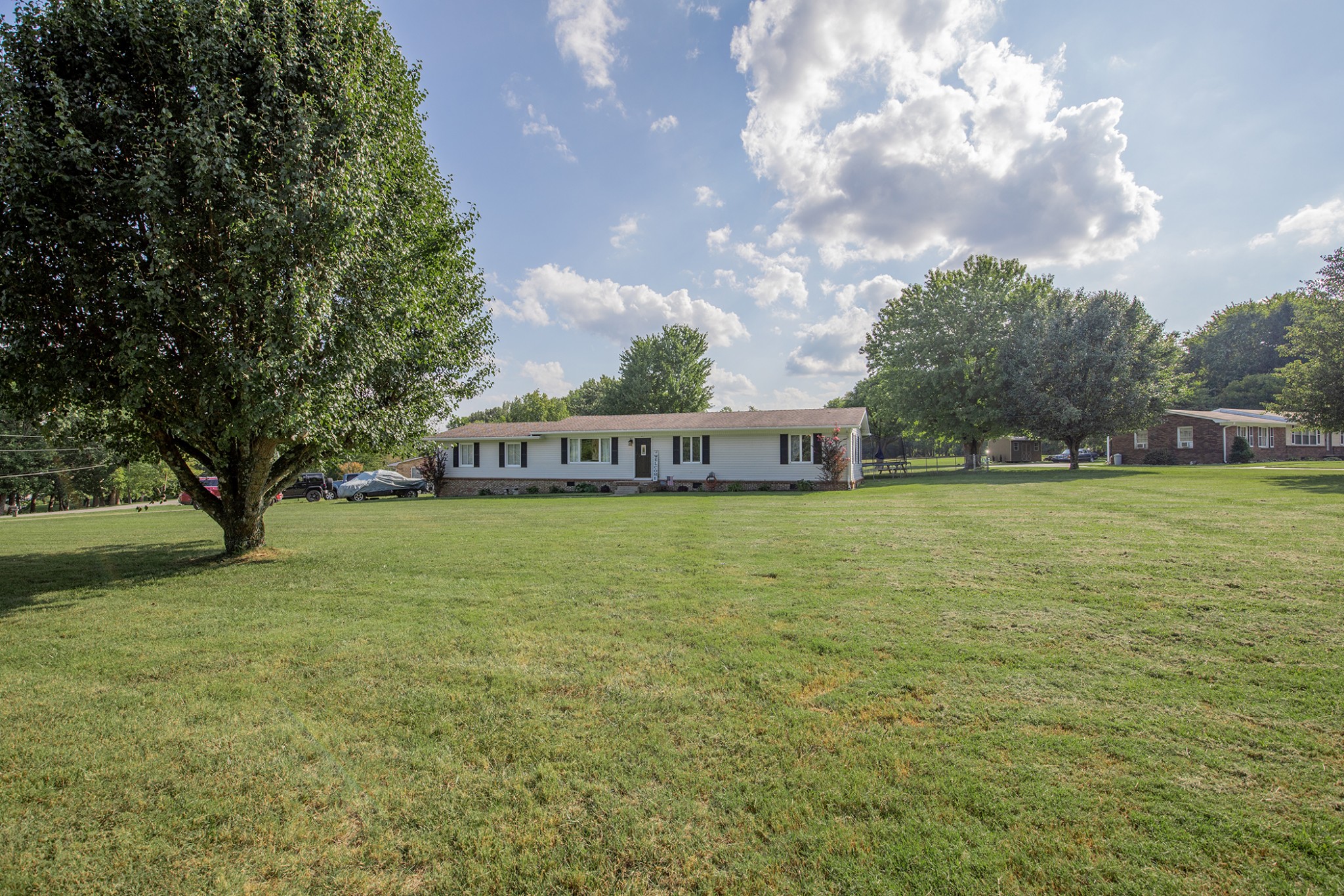 385 Lee Road Cottontown, TN 37048 - Photo 2 of 34 a front view of a house with garden