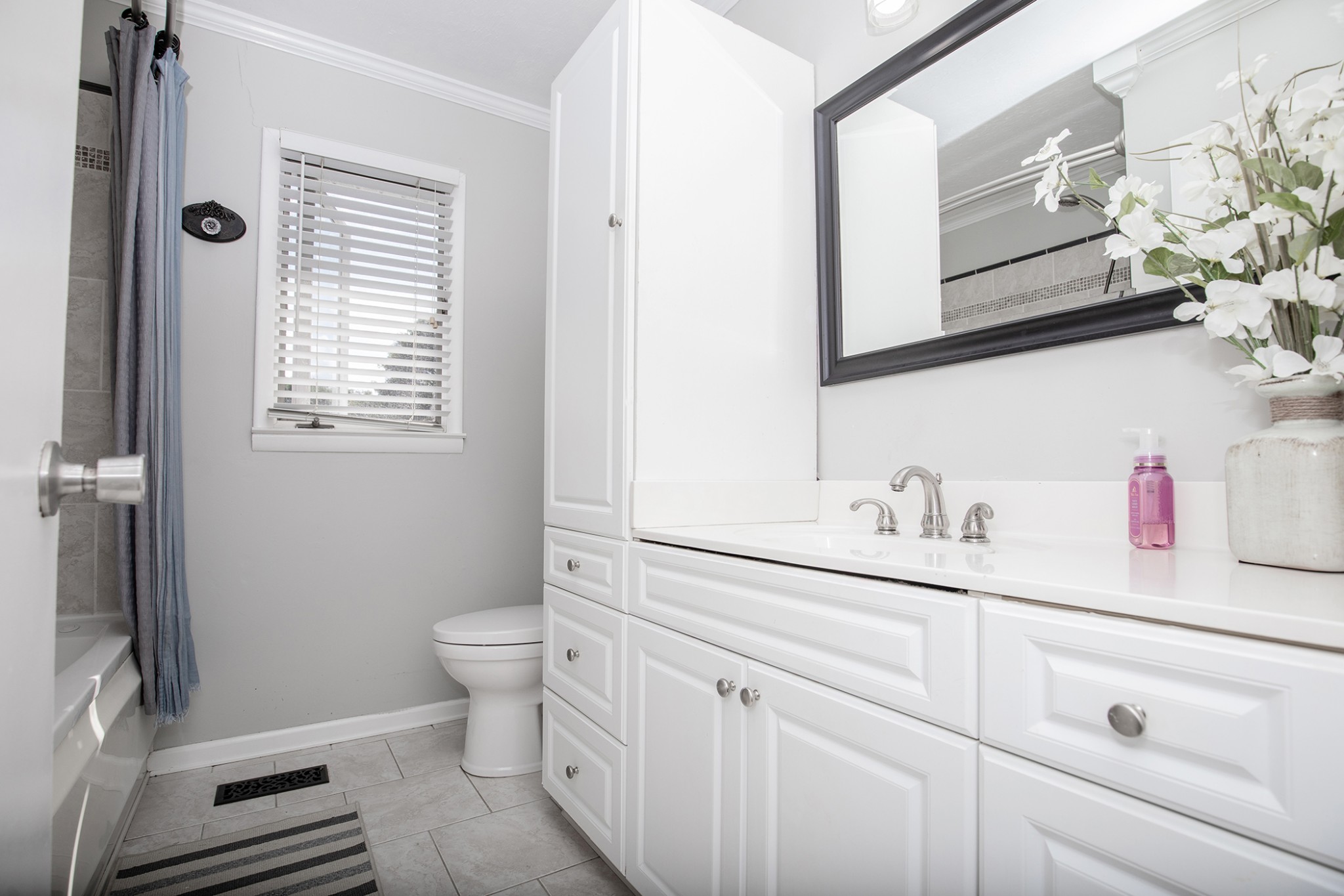 385 Lee Road Cottontown, TN 37048 - Photo 22 of 34 a bathroom with a sink a toilet and mirror