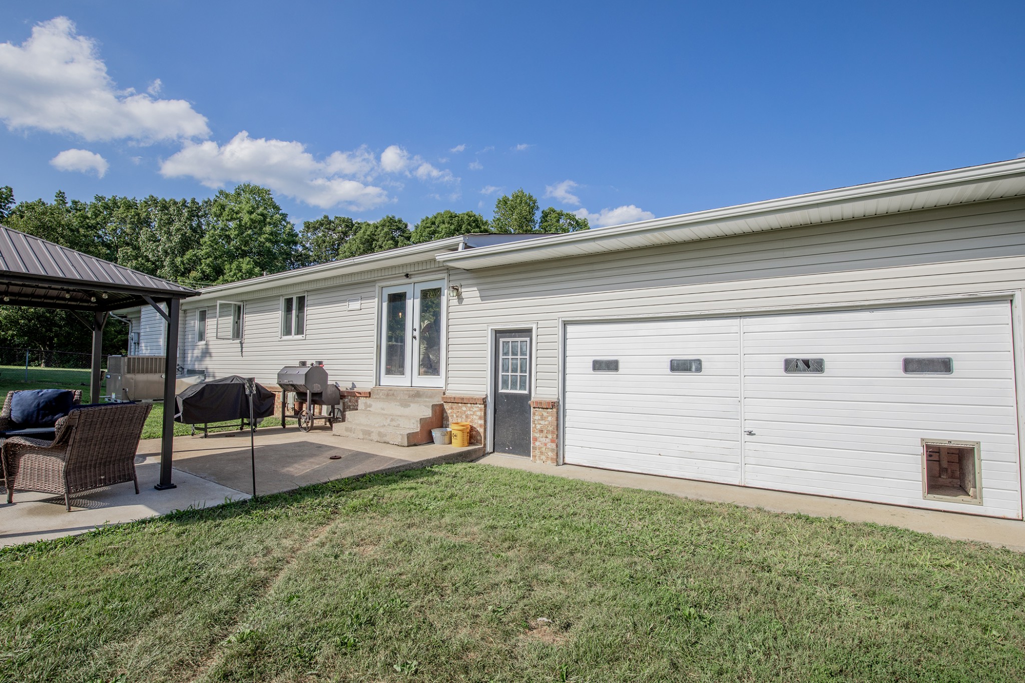 385 Lee Road Cottontown, TN 37048 - Photo 29 of 34 a view of a house with backyard and sitting area