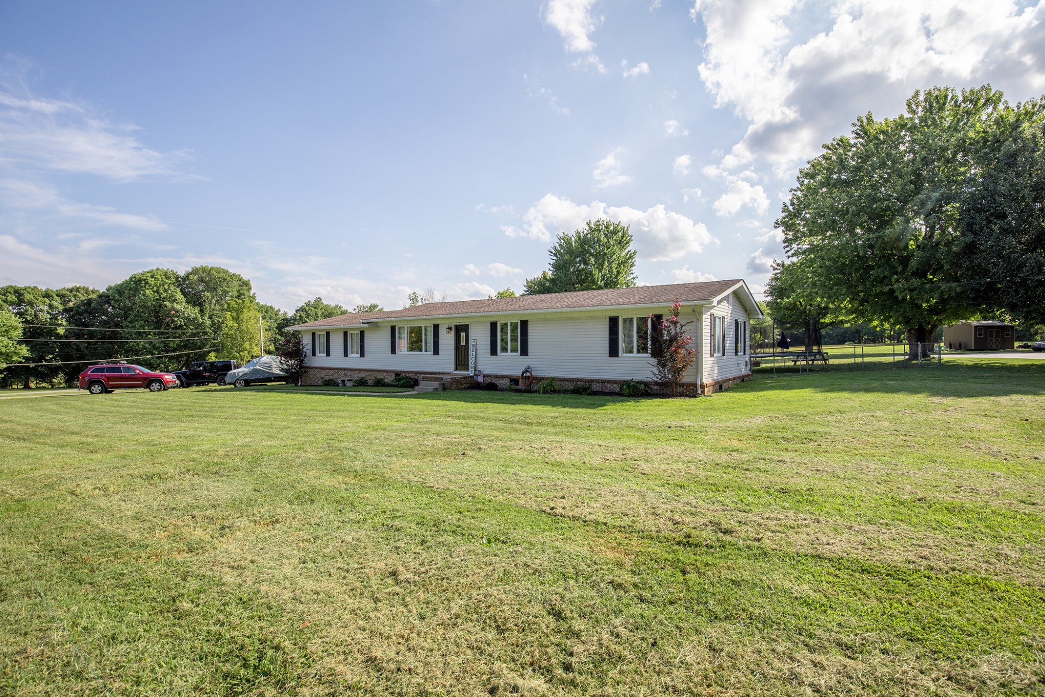 385 Lee Road Cottontown, TN 37048 - Photo 3 of 34 a front view of a house with a garden