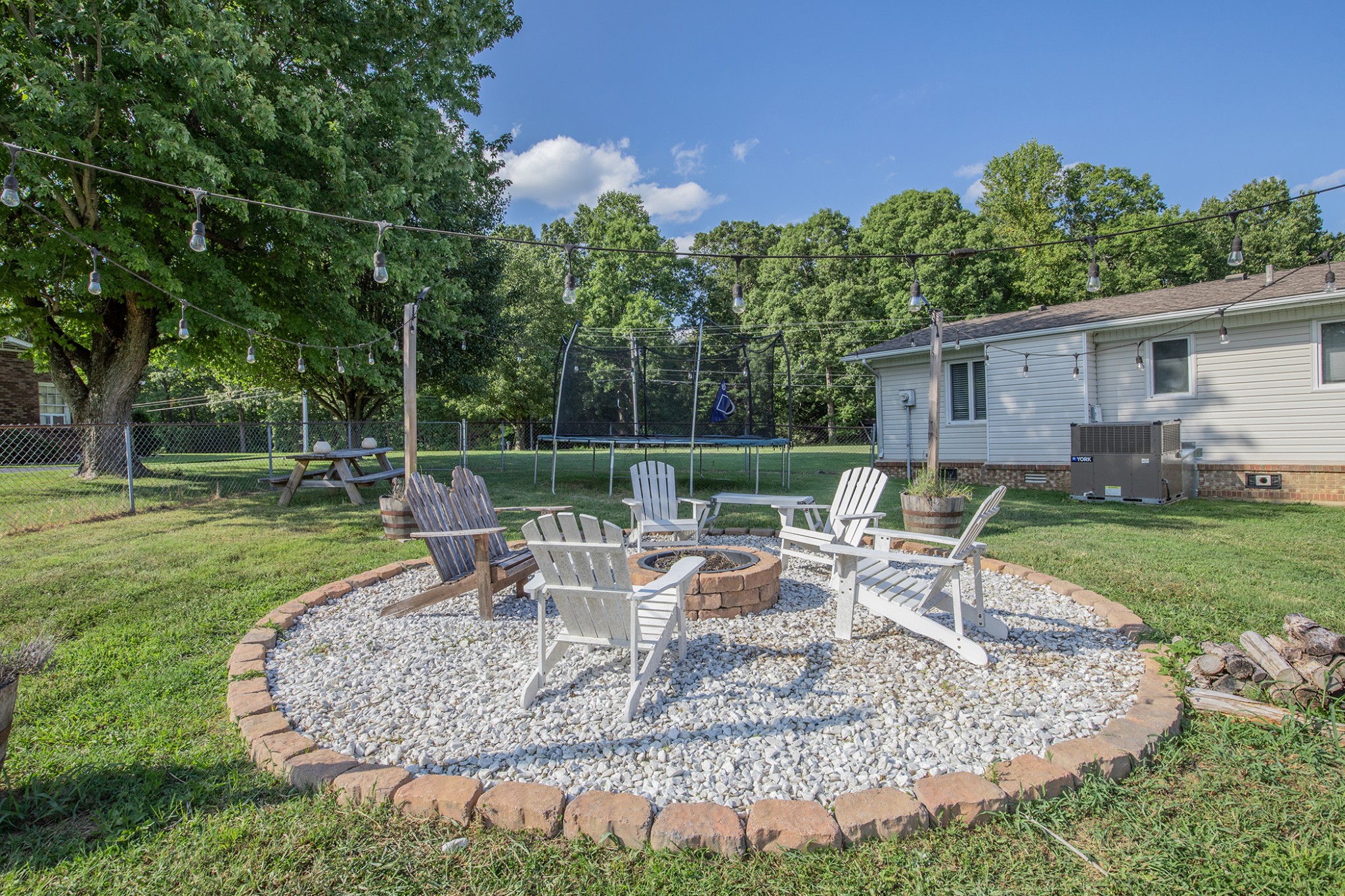 385 Lee Road Cottontown, TN 37048 - Photo 34 of 34 a view of a house with backyard sitting area and garden