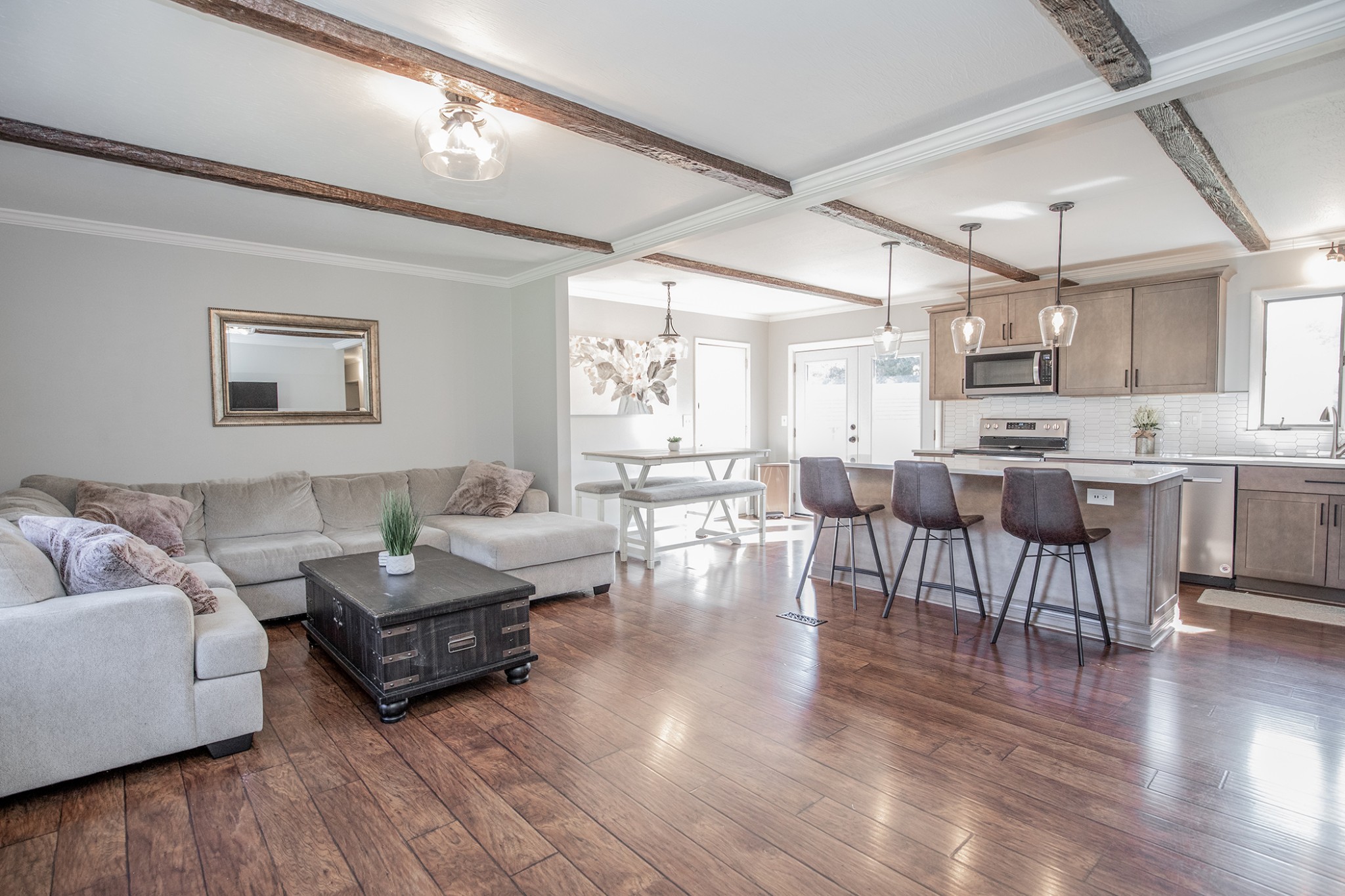 385 Lee Road Cottontown, TN 37048 - Photo 6 of 34 a living room with couches and a dining table with wooden floor