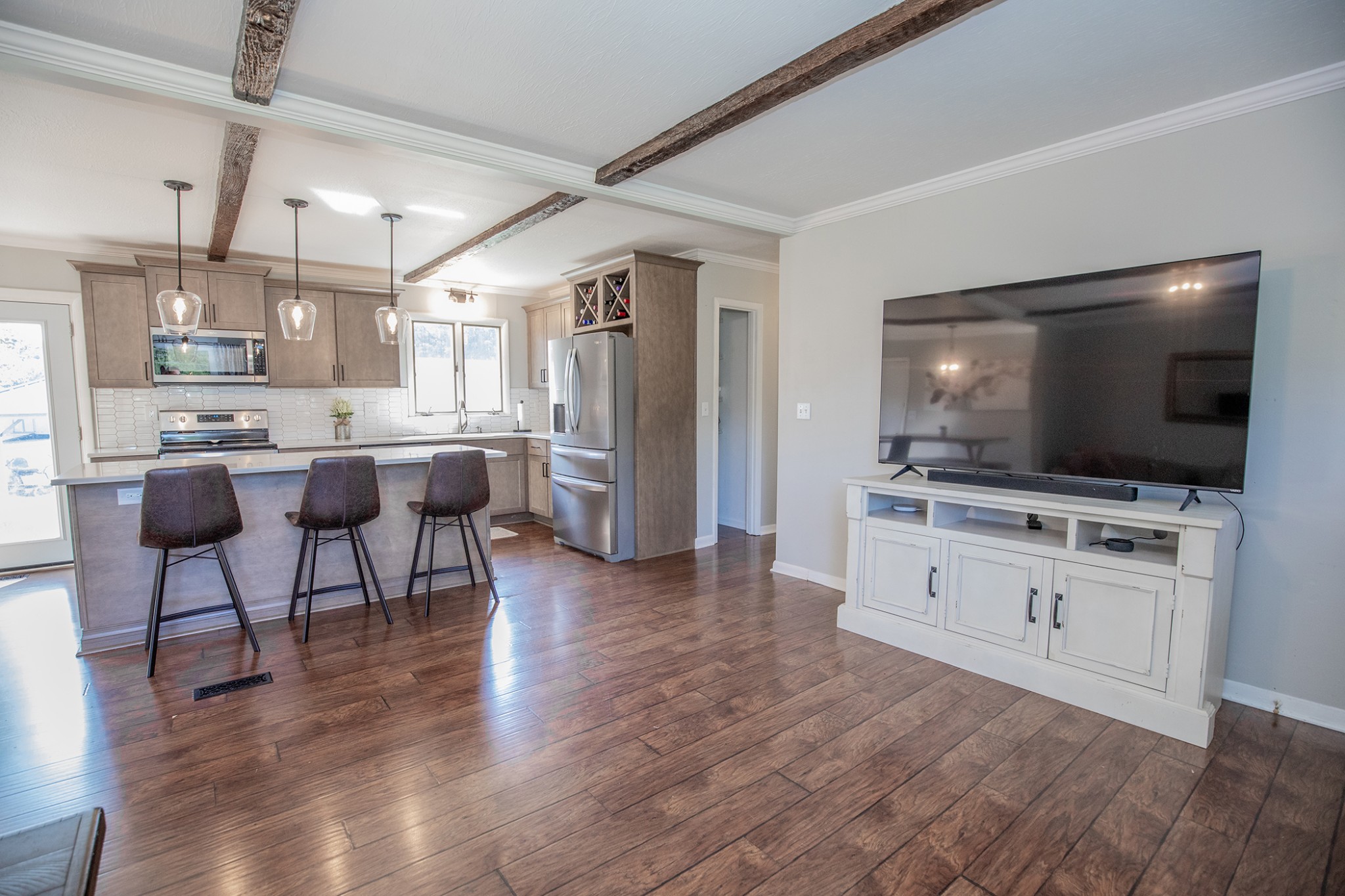 385 Lee Road Cottontown, TN 37048 - Photo 9 of 34 a living room with stainless steel appliances kitchen island granite countertop furniture and a flat screen tv