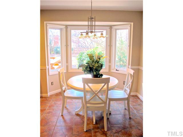 8521 Kempton Road Raleigh, NC 27615 - Photo 9 of 25 Spacious breakfast area in kitchen with bay window overlooking pool and deck. Breakfast Area